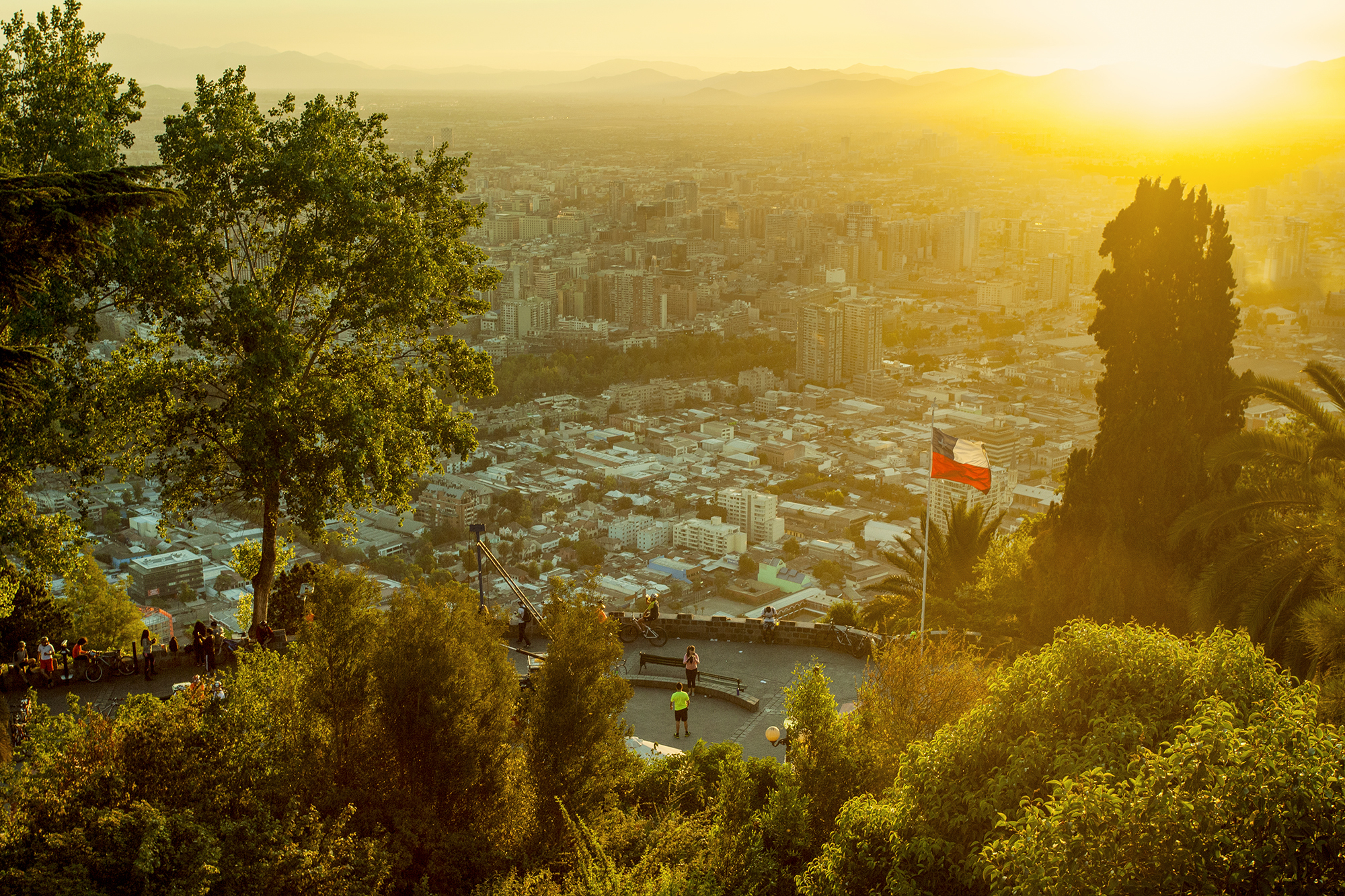 View of Santiago, Chile in the sunset with the flag on the right side