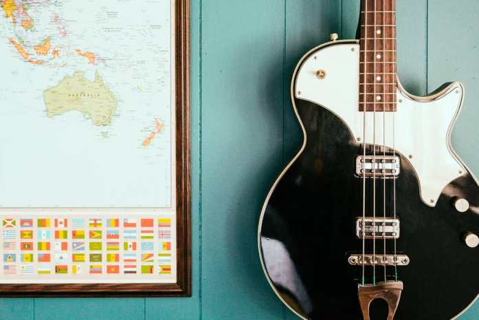 Guitar and map hanging on display