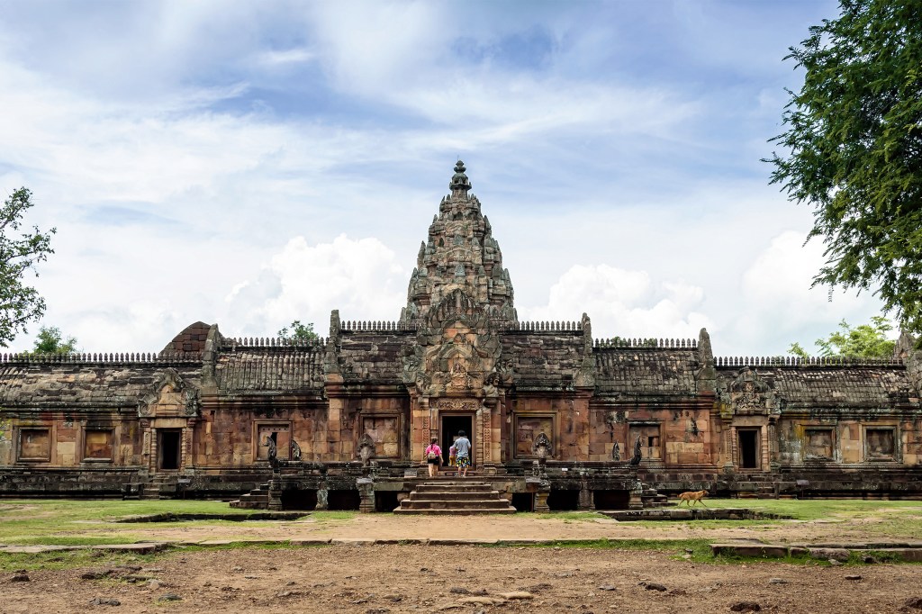 Travelers walking into the entrance of Phanom Rung Castle in Buriram Thailand.