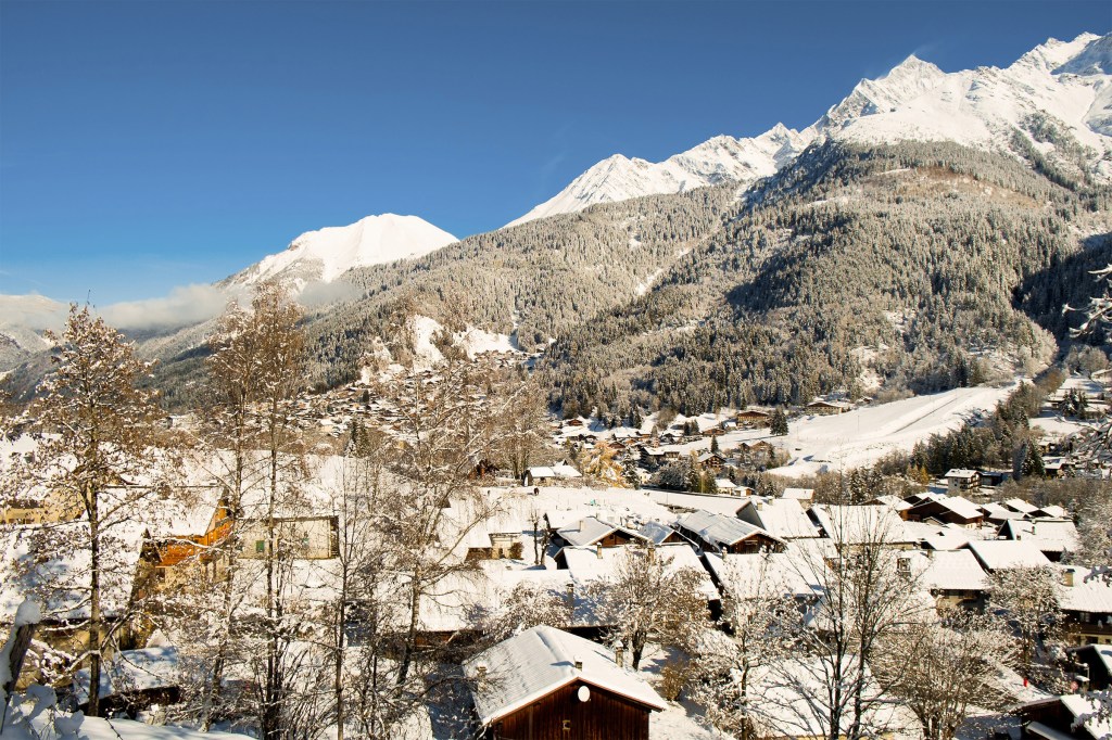 Winter view of Mont Blanc and Les Contamines village in Chamonix, France.