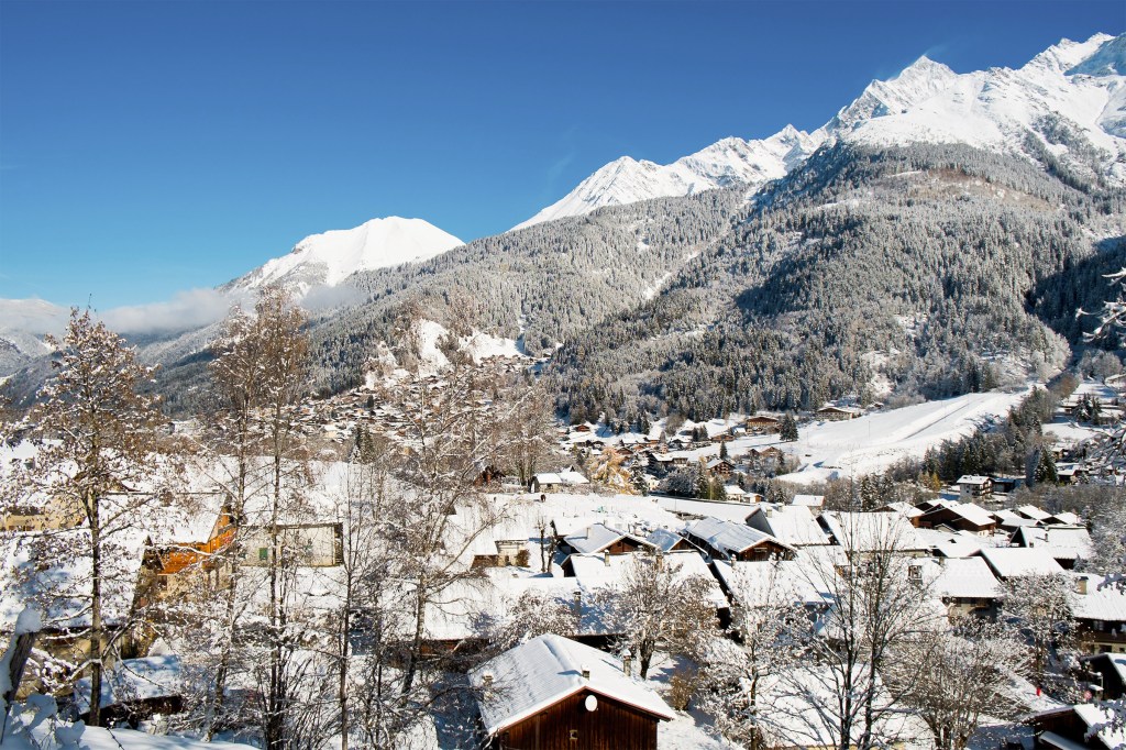 Winter view of Mont Blanc and Les Contamines village in Chamonix, France.