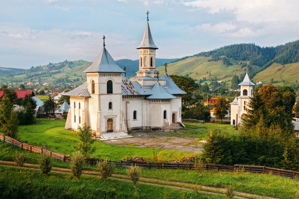 Romanian mountain landscape and church.