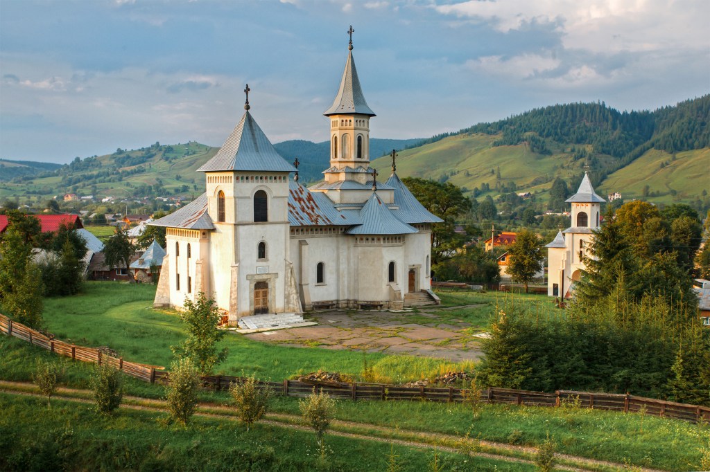 Romanian mountain landscape and church.