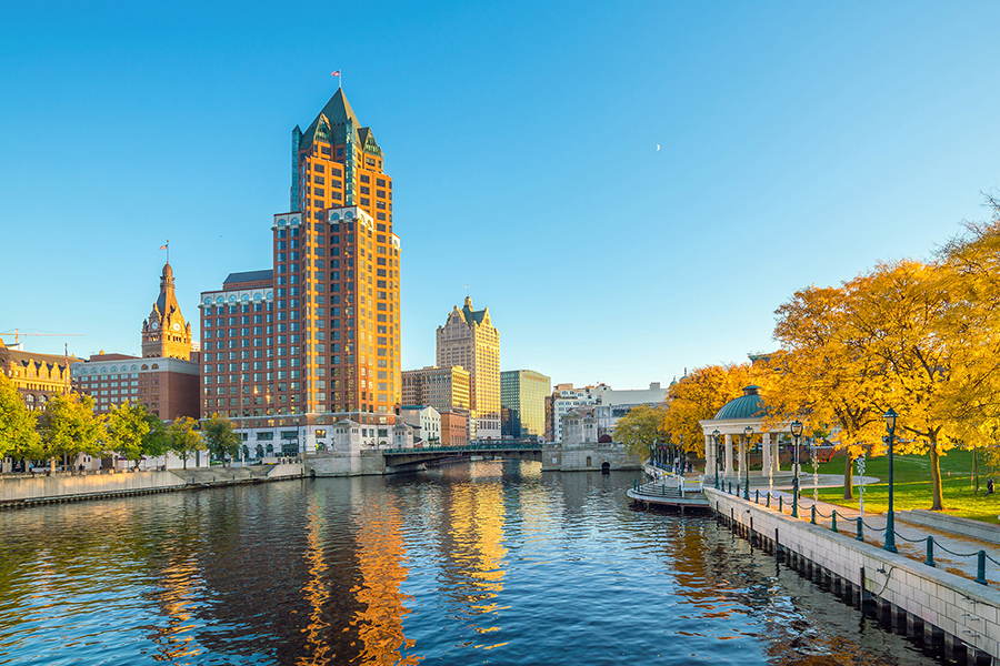 Milwaukee downtown skyline with buildings along the Milwaukee River.
