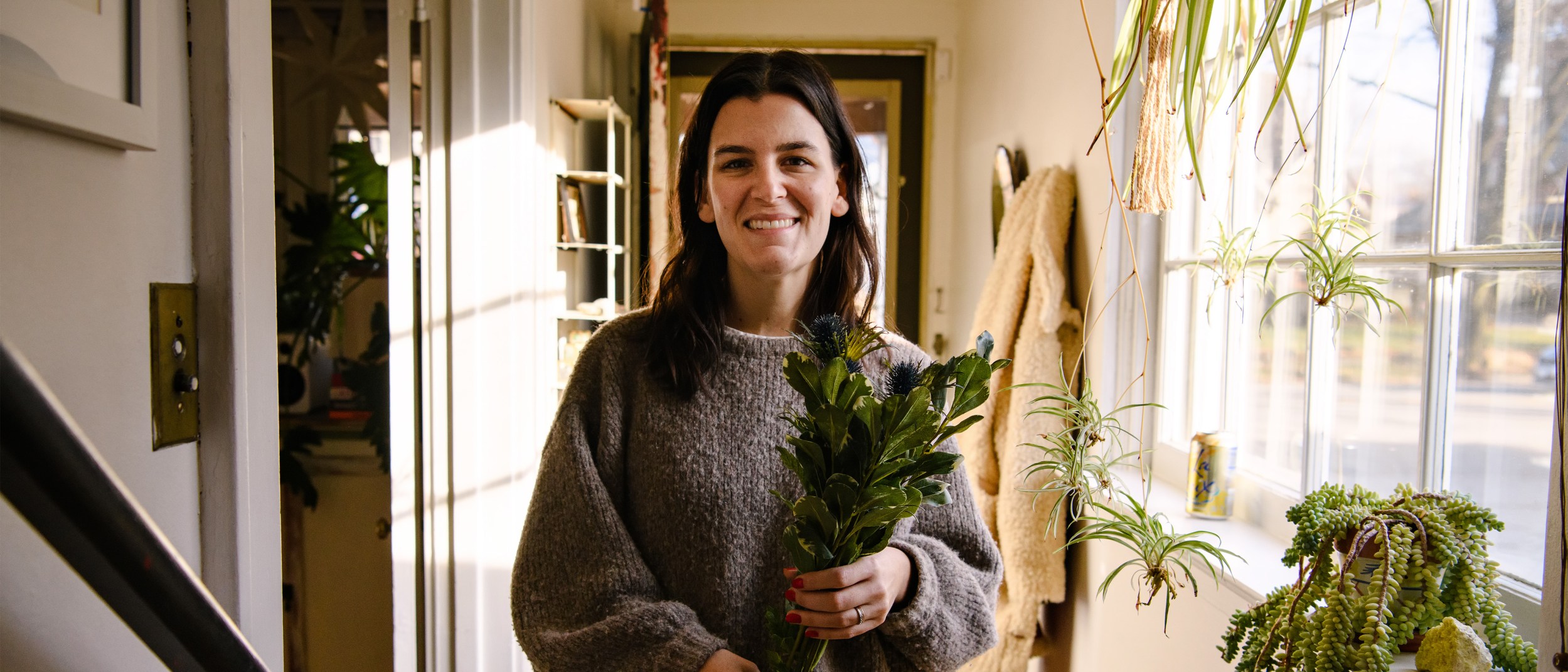 An Airbnb hosts prepares for her guests with some fresh flowers.