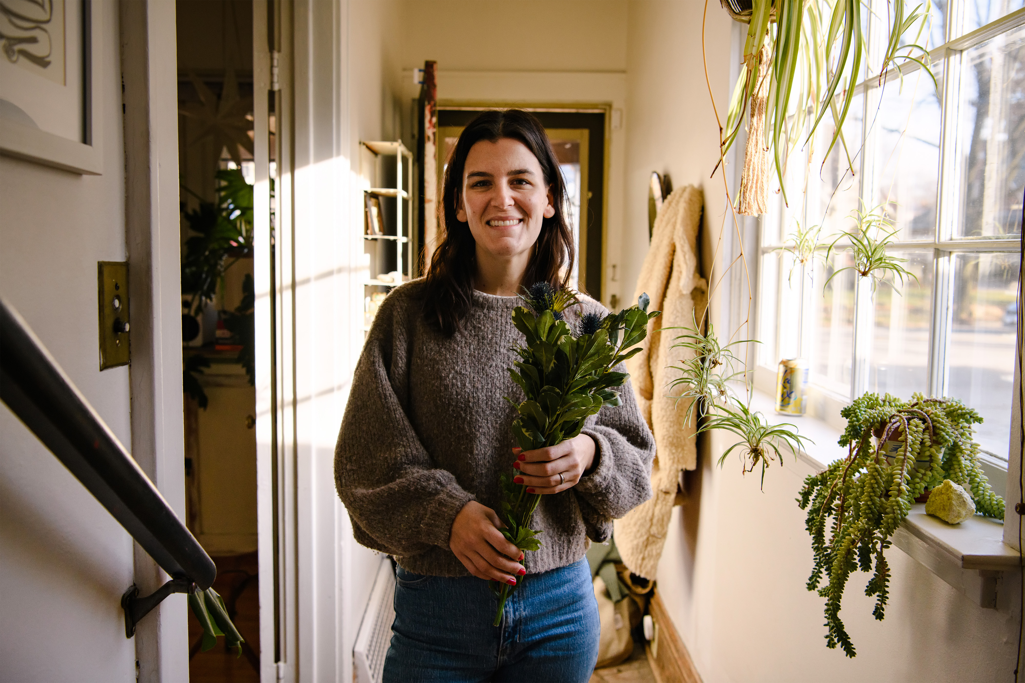 An Airbnb hosts prepares for her guests with some fresh flowers.