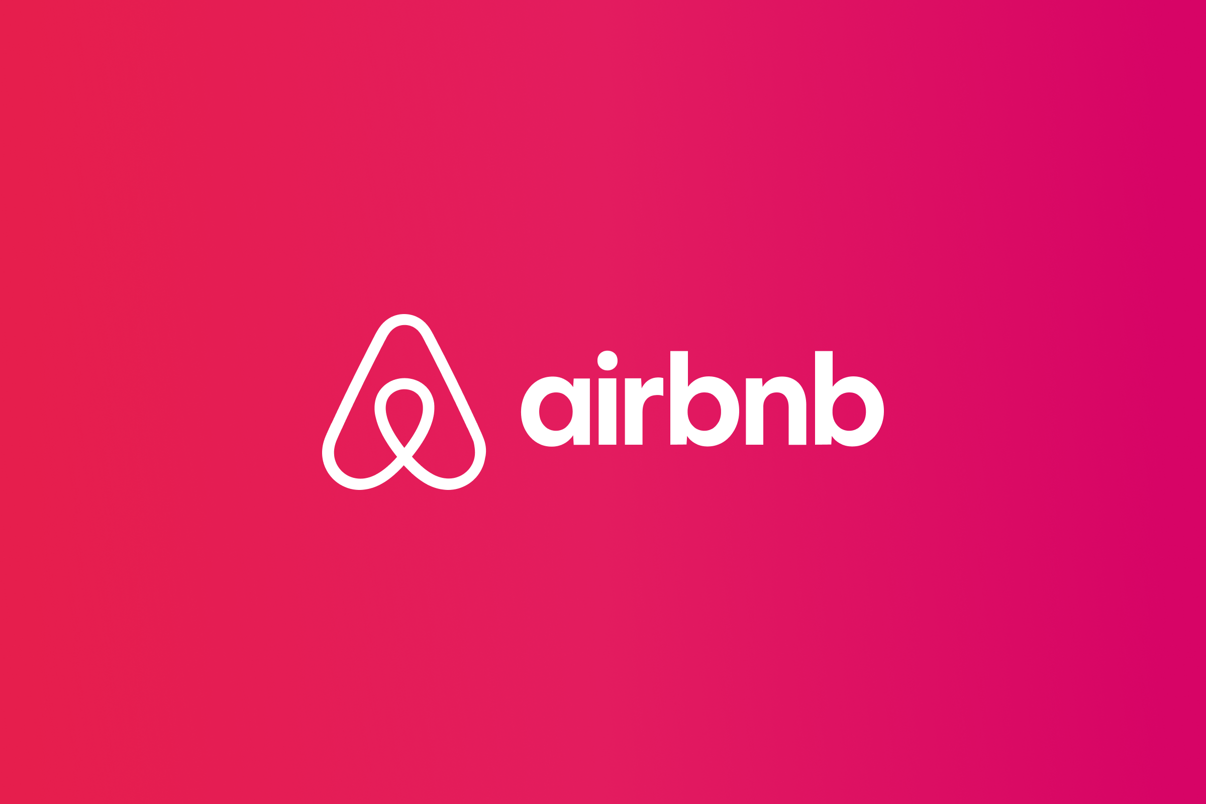 White Airbnb logo and wordmark lockup over a colorful gradient.