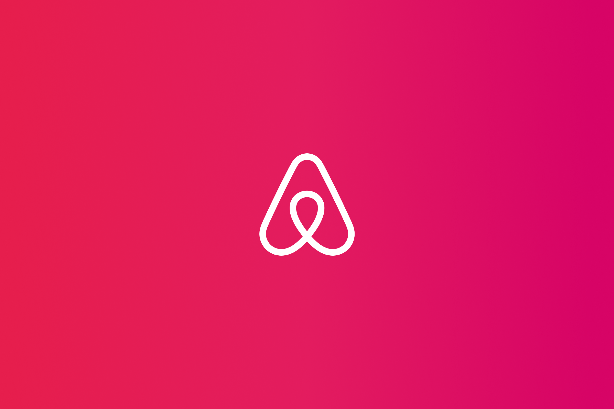 White Airbnb Bélo over a colorful gradient.