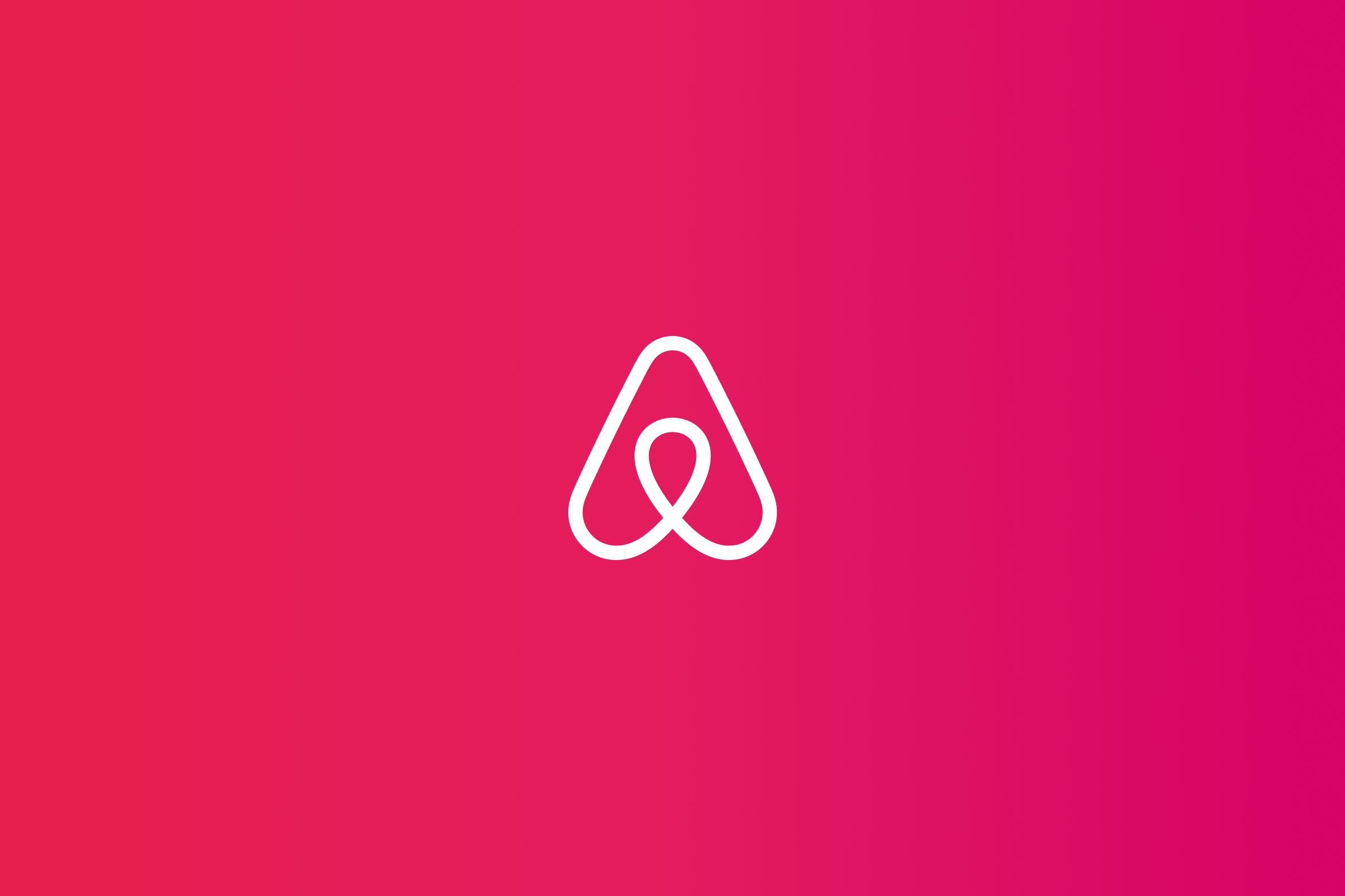 Airbnb logo placed on deep pink gradient colored background