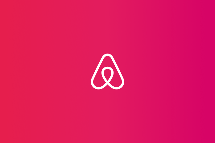 Airbnb logo placed on deep pink gradient colored background