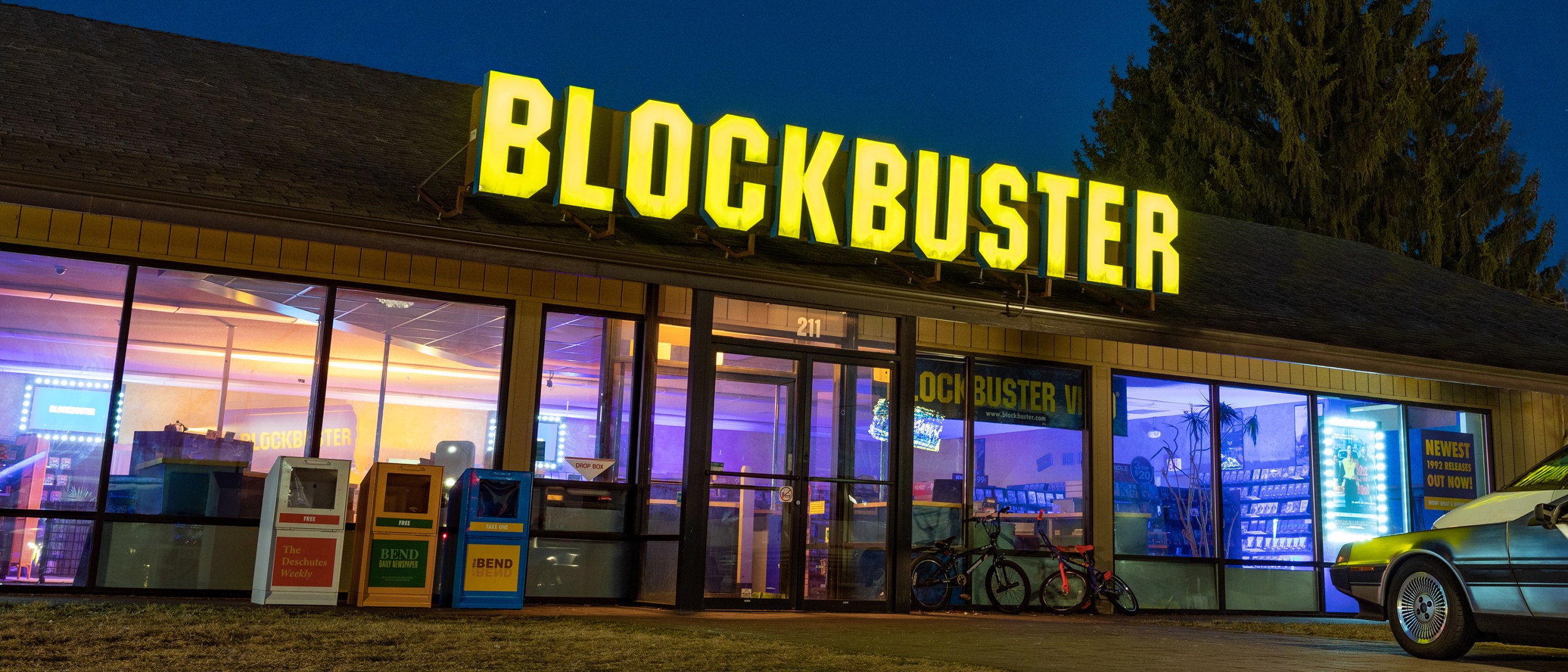 The bright sign illuminates the night sky at the world's last BLOCKBUSTER store in Bend, Oregon.