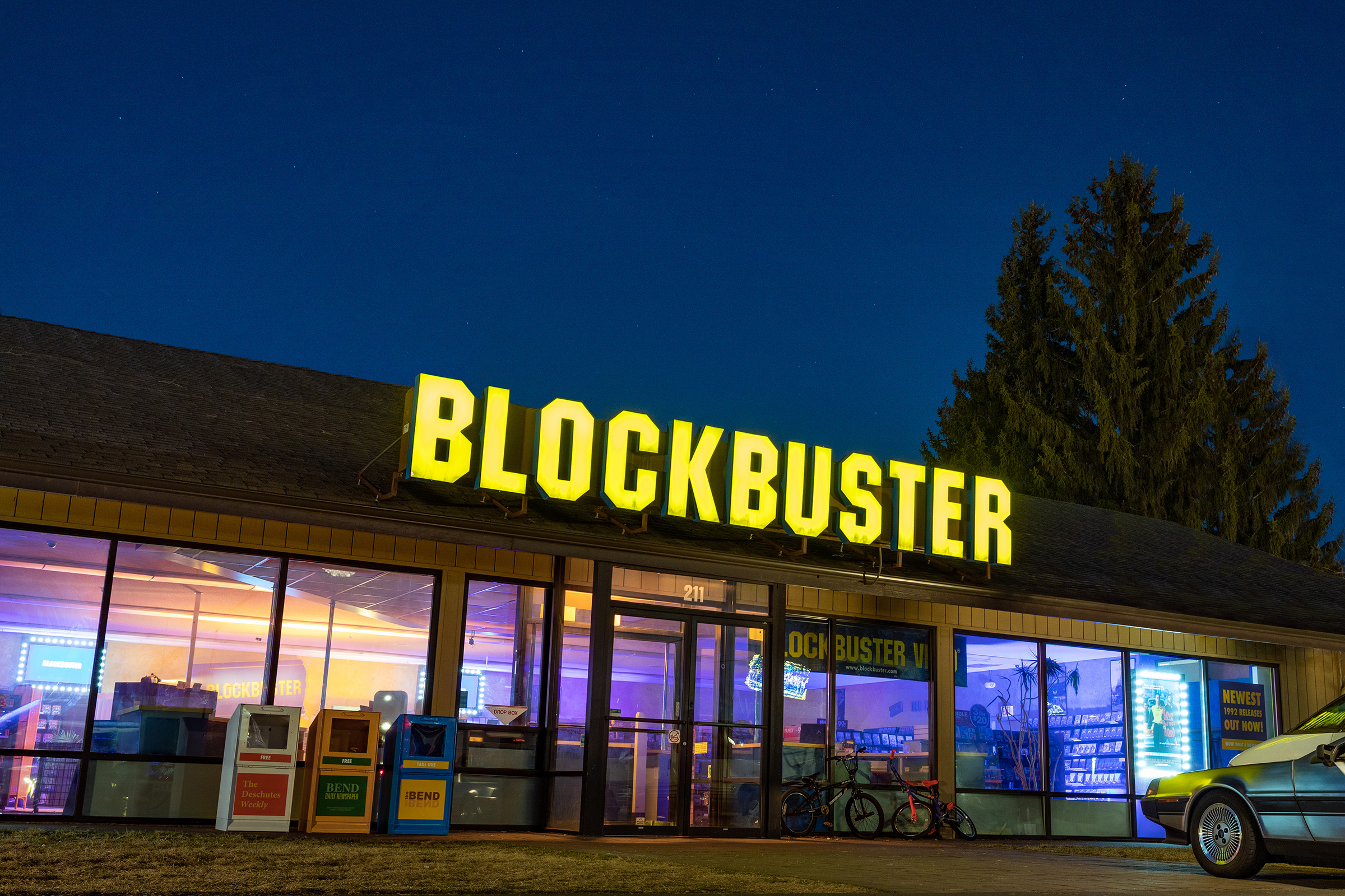 The bright sign illuminates the night sky at the world's last BLOCKBUSTER store in Bend, Oregon.