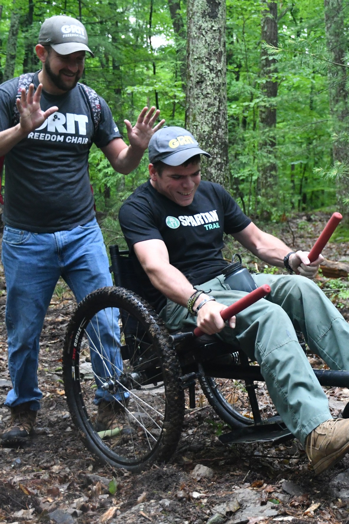 One guest doing adaptive hiking with Grit Freedom Chair in the forest.