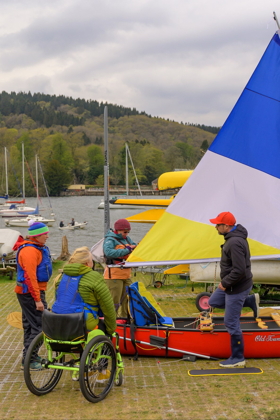 Several guests preparing to go canoe sailing on the lake in Newby Bridge, United Kingdom