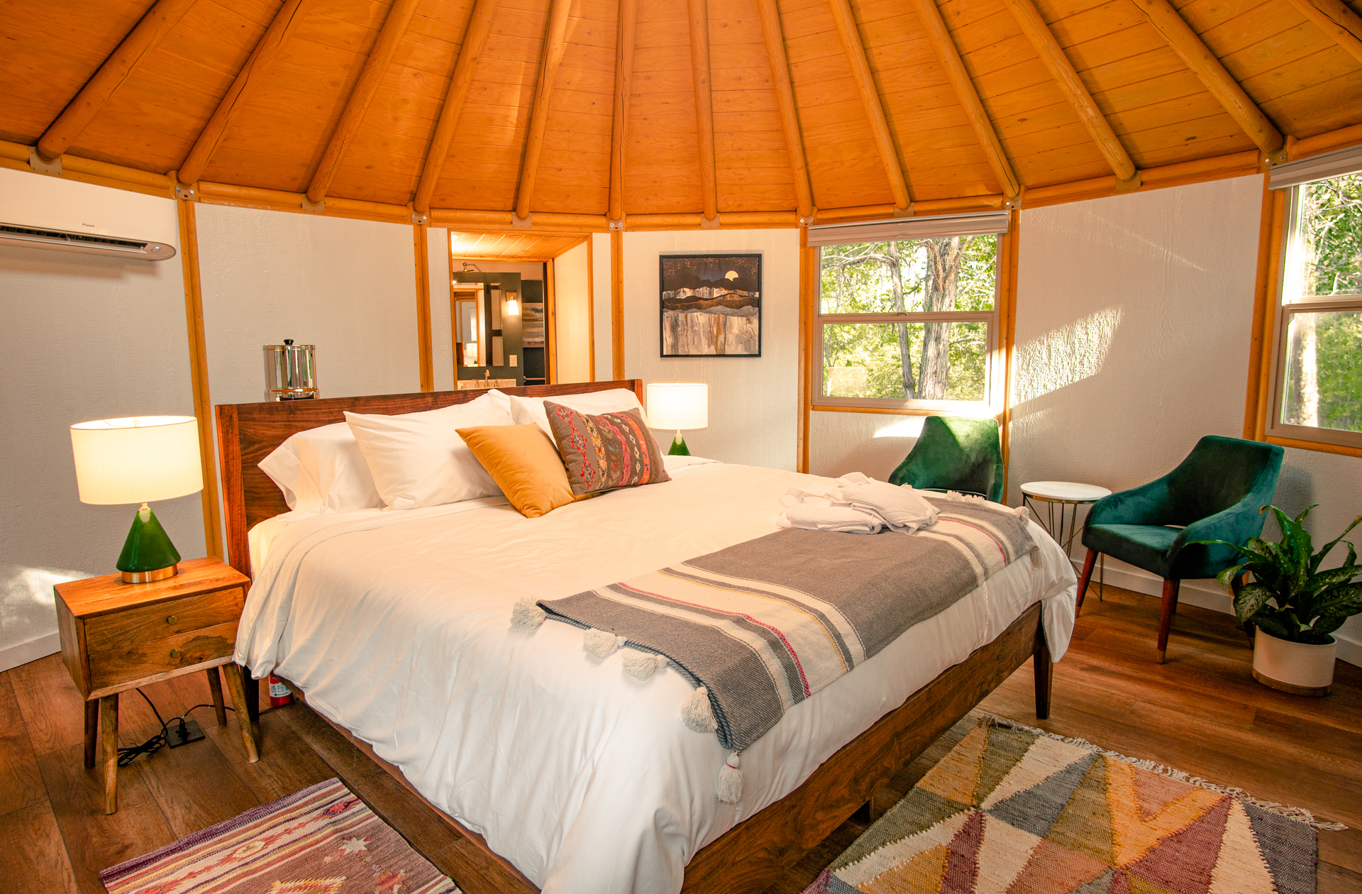 Bohemian bedroom of luxury yurt cabin in Bastrop, TX