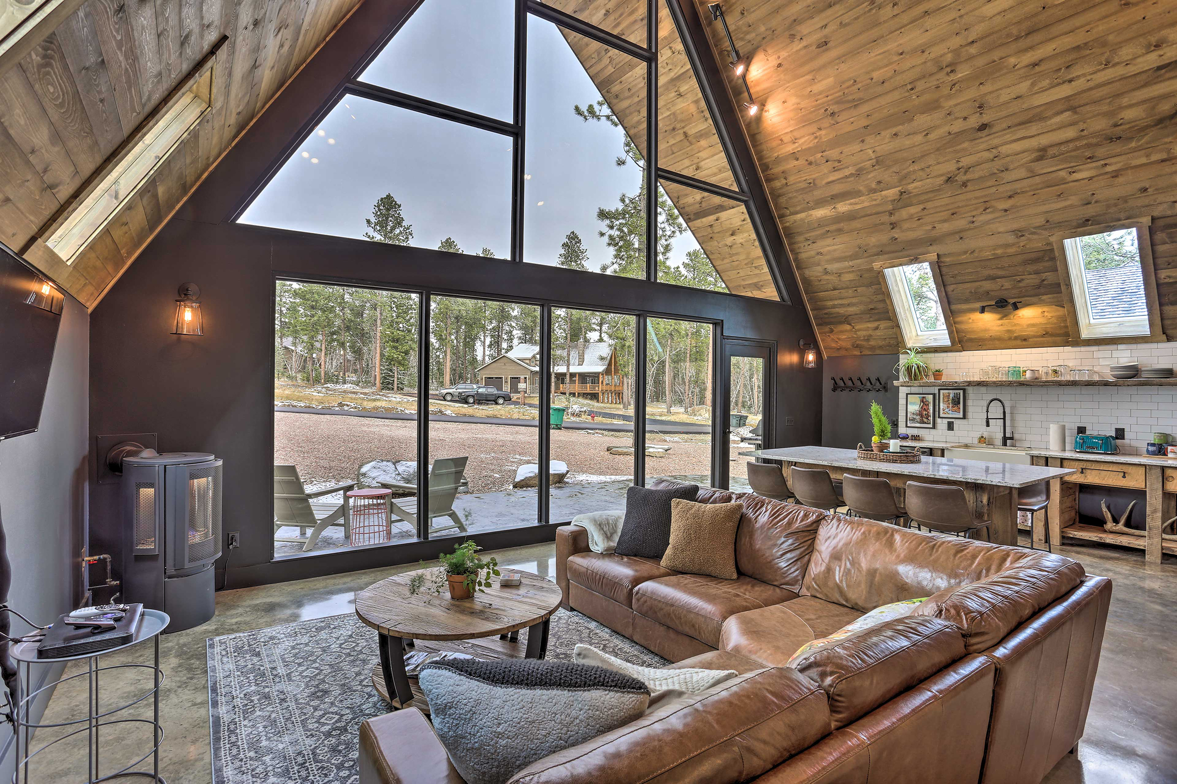 Open living room and kitchen floor plan view of the New Modern A-Frame stay in Black Hills, South Dakota