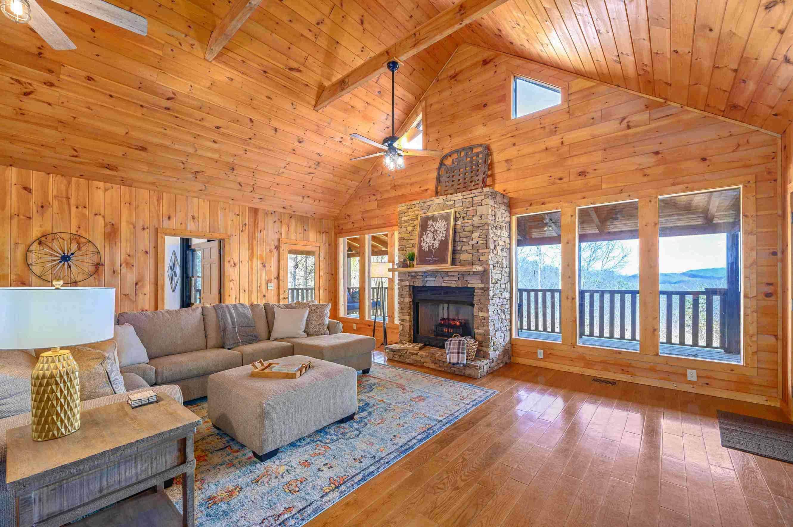 Living room with couch and fireplace at a handicap accessible cabin in Sevierville, TN