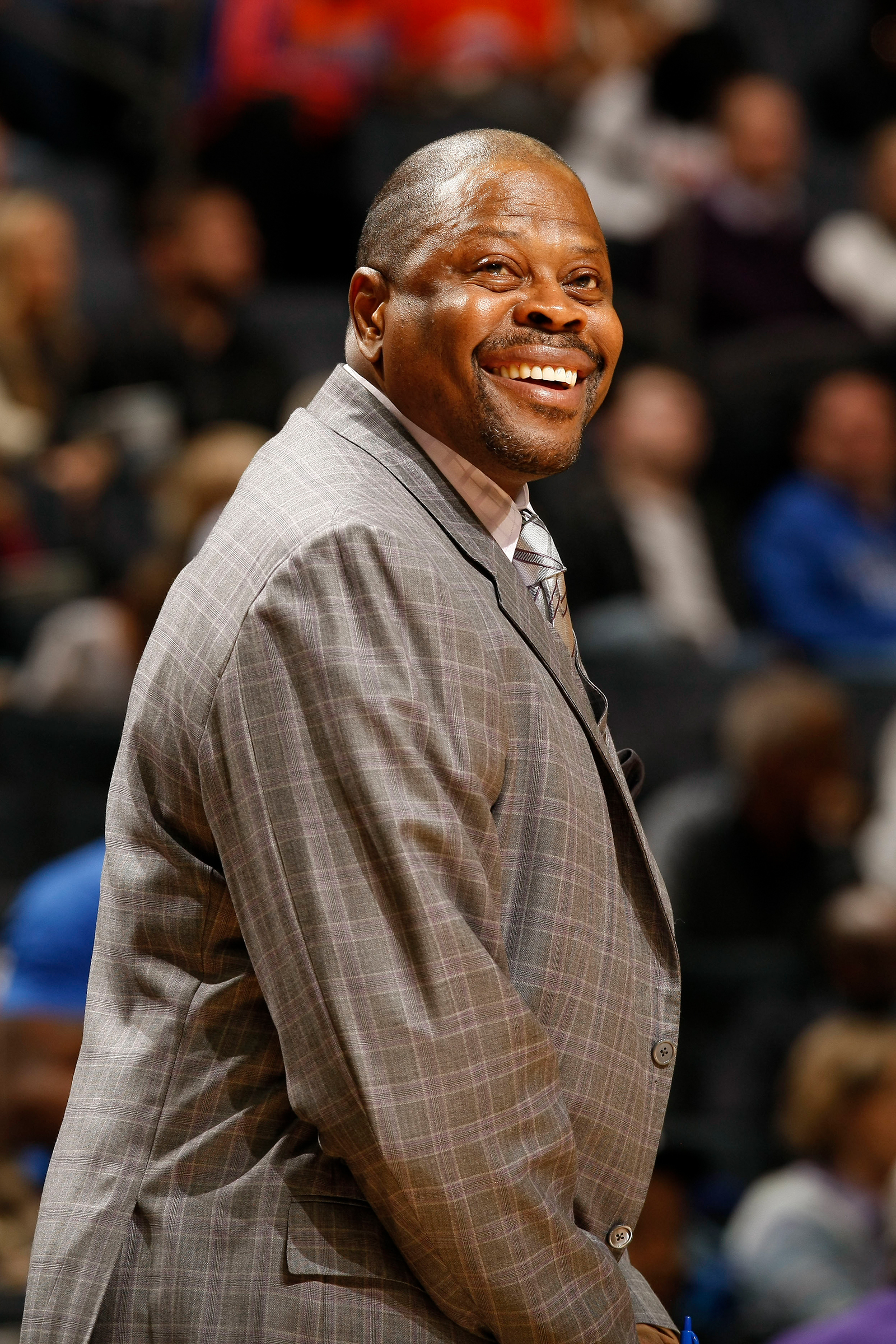 Patrick Ewing, assistant coach of the Charlotte Hornets smiles during the game against the New York Knicks at the Time Warner Cable Arena on January 23, 2016 in Charlotte, North Carolina. 