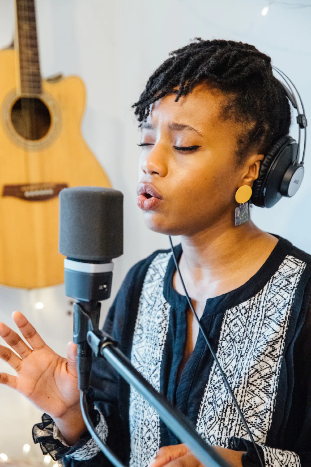 Woman singing into a microphone