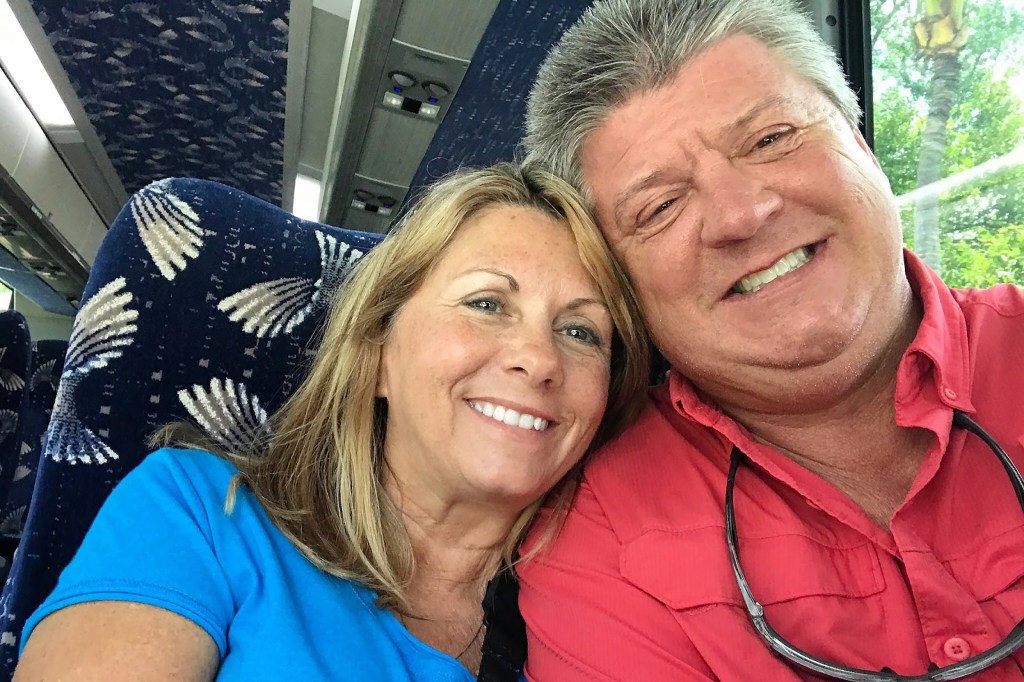 Airbnb Host Charles and his wife Brenda taking a selfie from their bus seat.