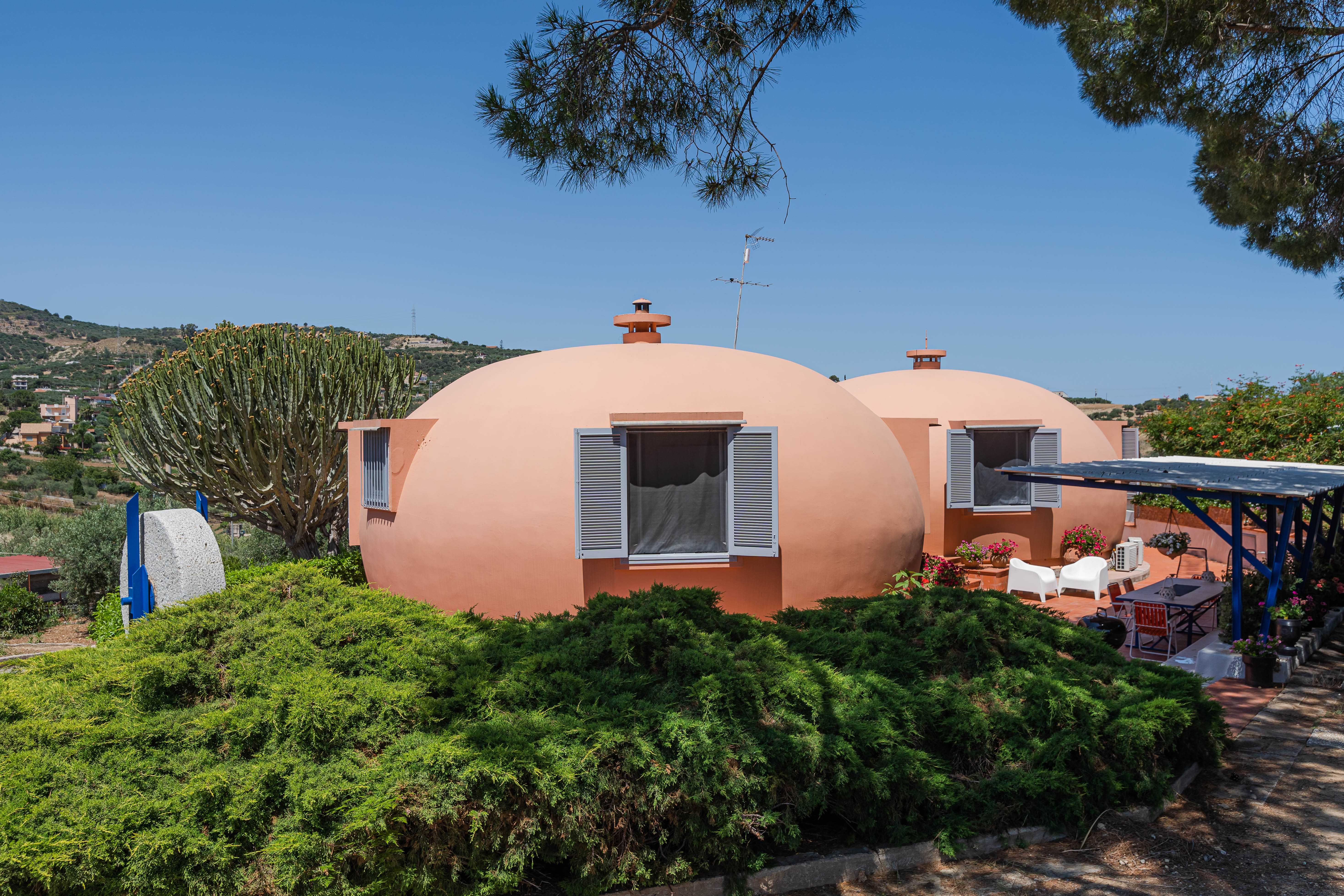 Dome House (Sicily, Italy)Dive into Sicilian culture from this red domed home surrounded by a lemon, orange and olive garden. 