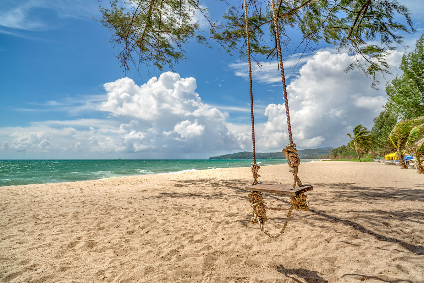 Bang-Tao-Beach_m View of a beach with white sand and palm trees