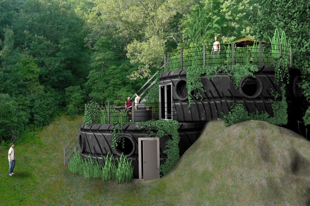 A home in the shape of two stacked tires with greenery growing out of the grooves