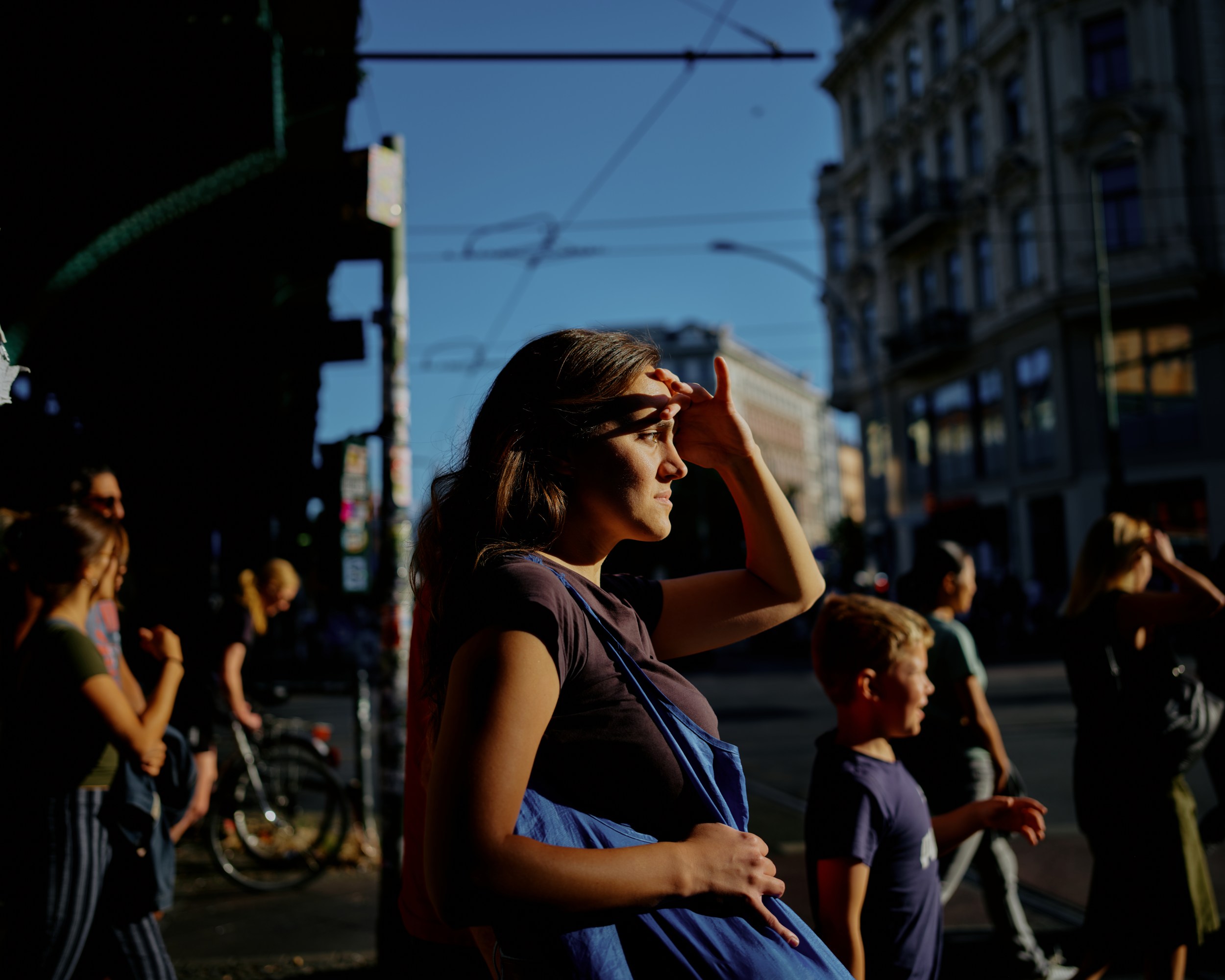 Airbnb Host Mary stands in the street looking out