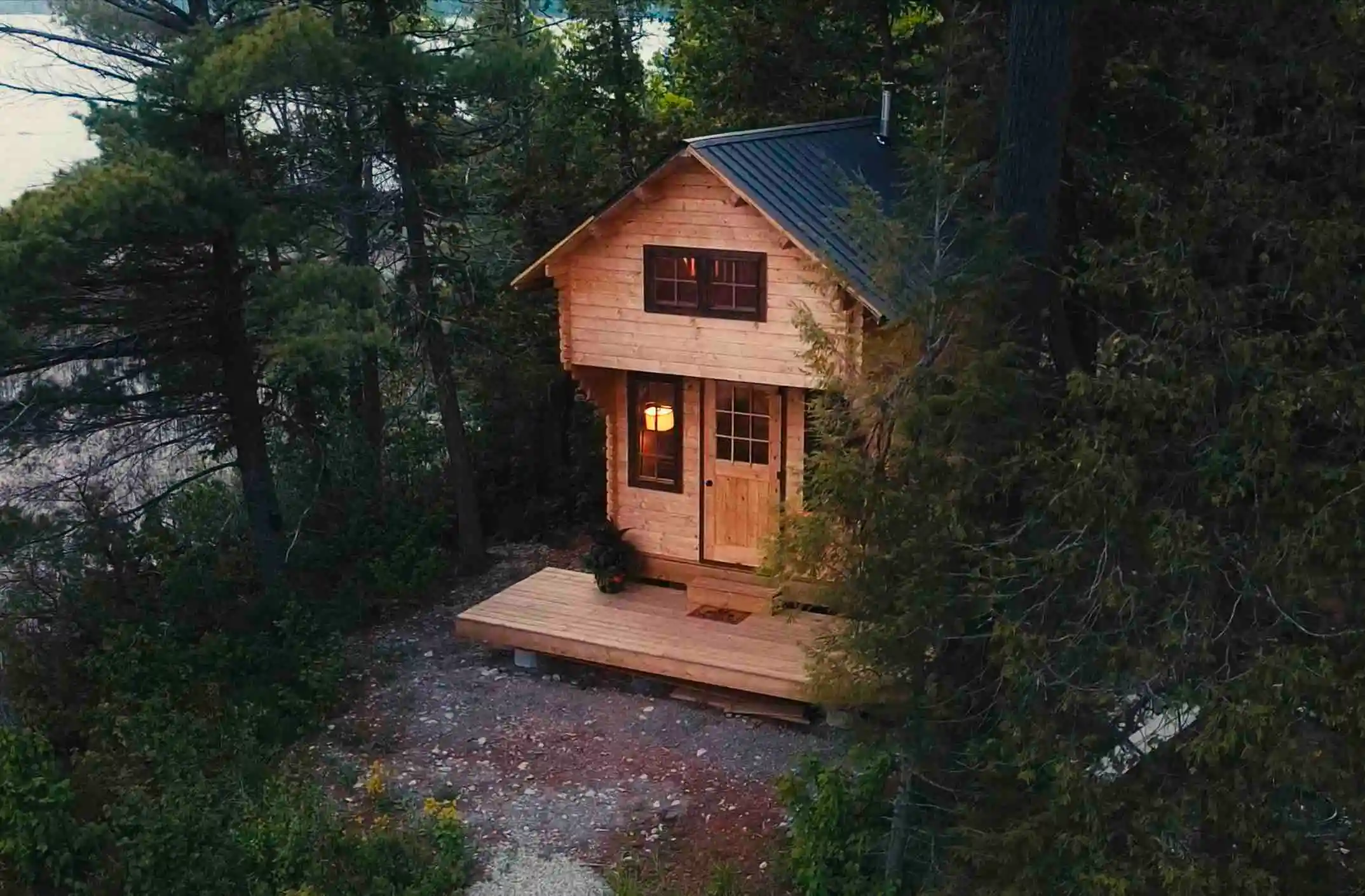 A wood cabin nestled amongst the trees. 