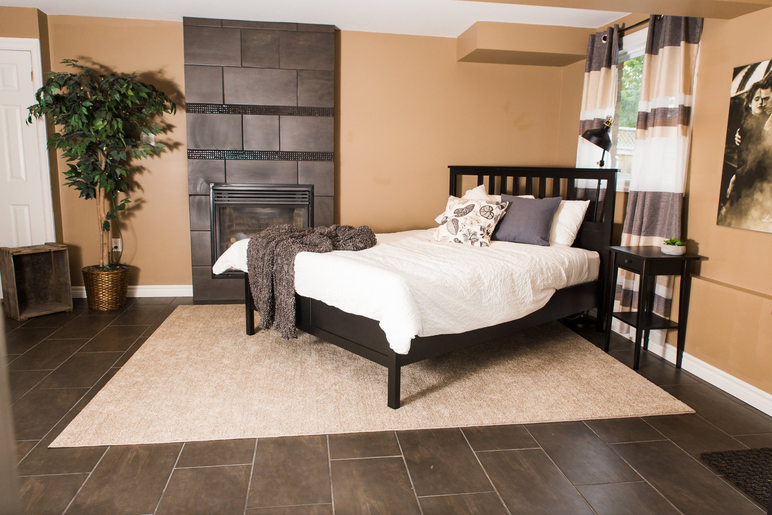 A main bedroom with a cozy fireplace in Orangeville, Ontario. 