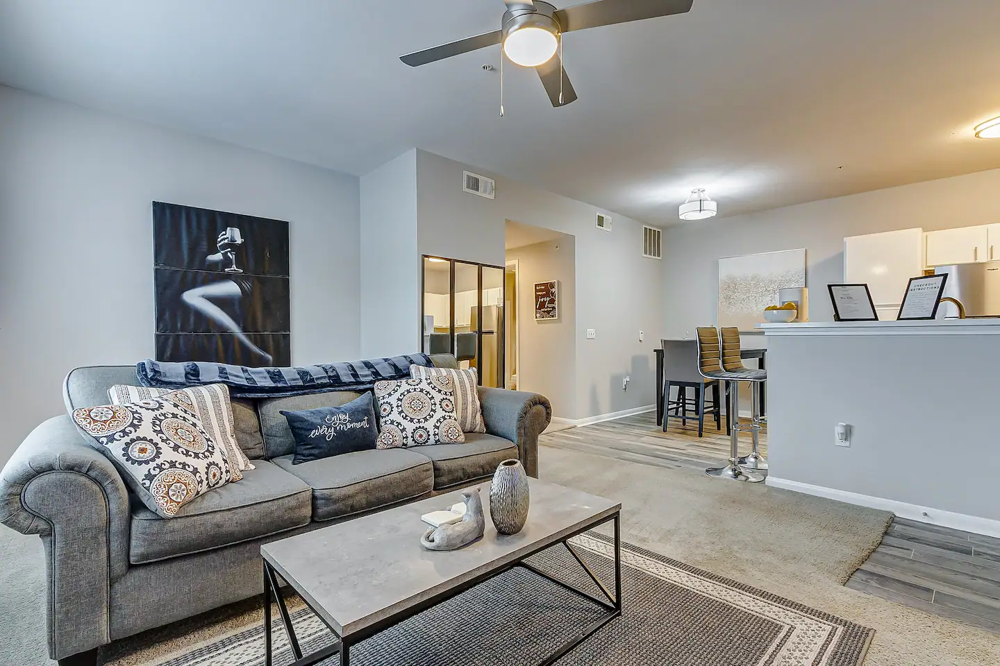 Image depicting couch and coffee table in living room of an affordable Houston Airbnb