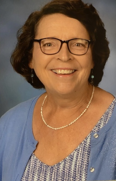 Woman smiling for a photo.