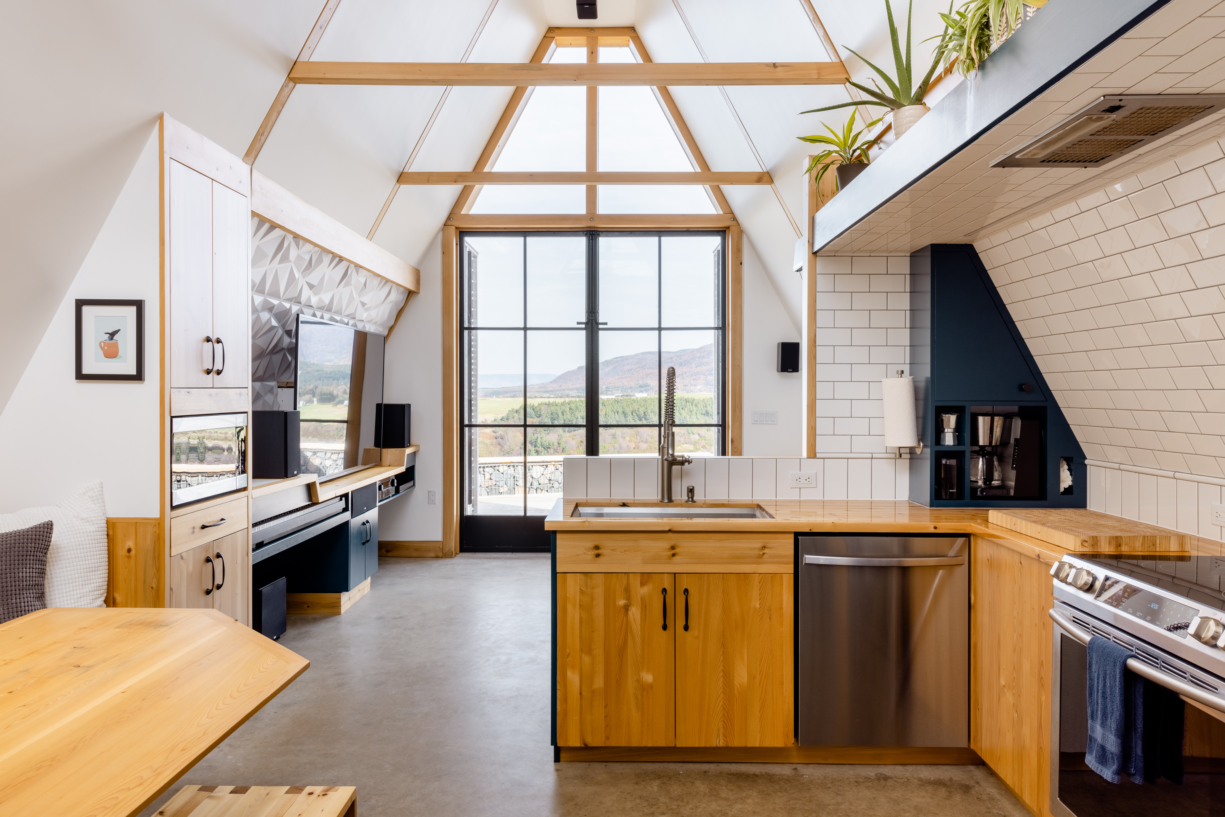 Image of a kitchen and dining space in design inspired chalet in Nova Scotia