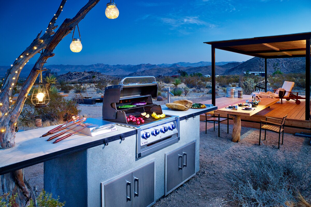 BBQ area looking out on Joshua Tree with decking and dining table in the background