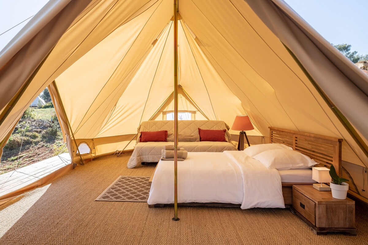 Glamping tent with double bed and sofa