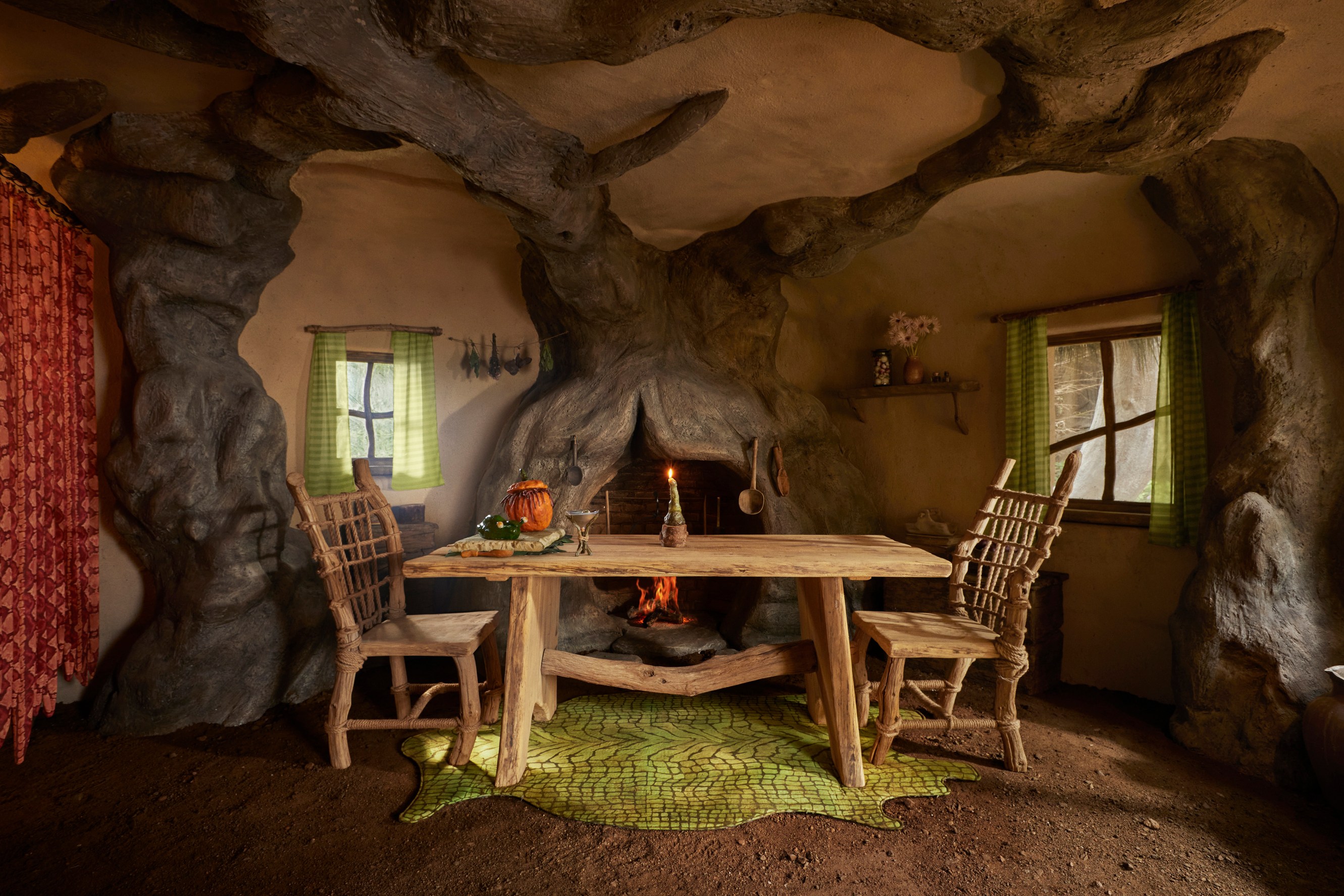 Dining table with two chairs in the kitchen of Shrek's Swamp