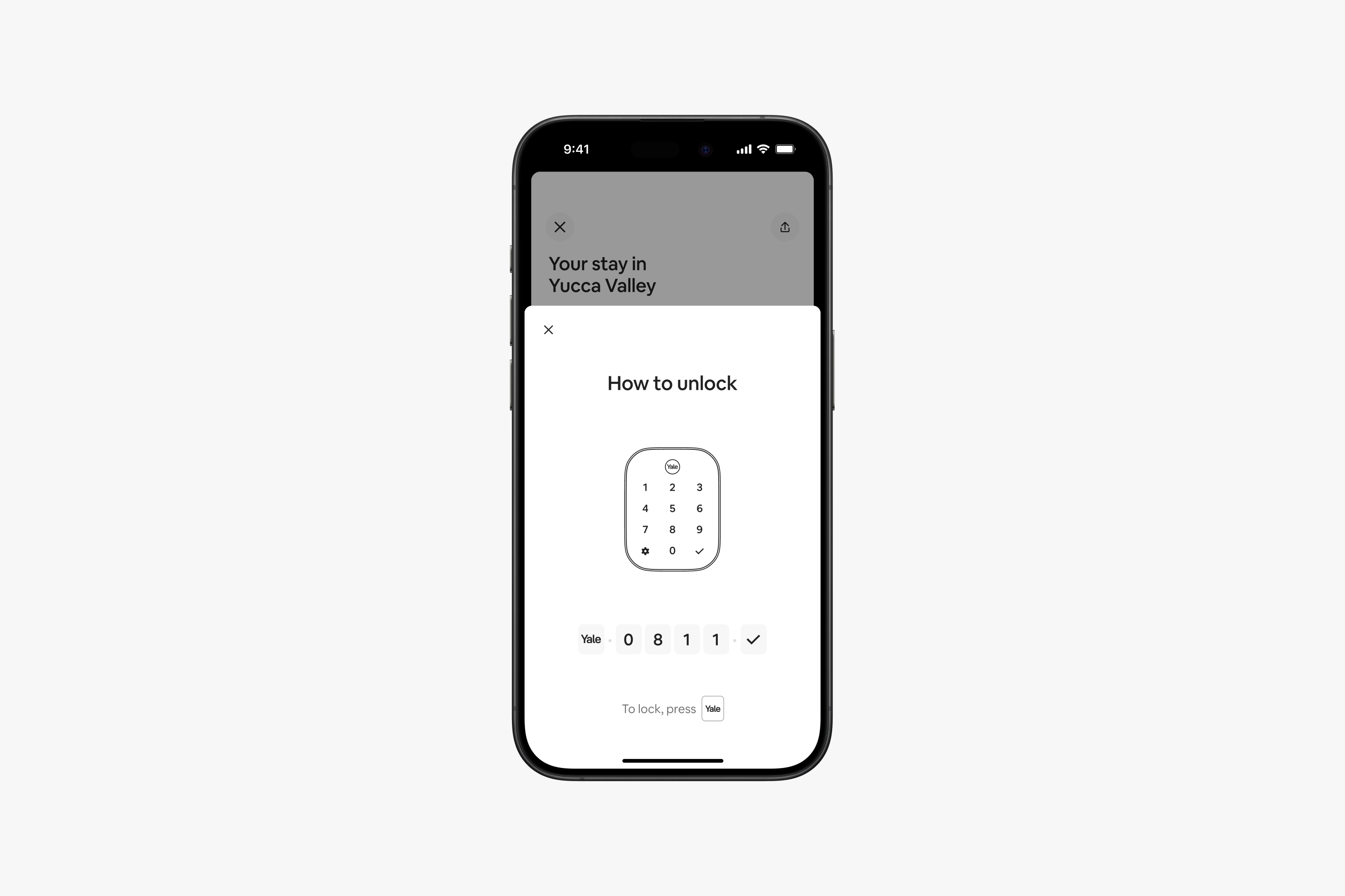 Phone screen displaying how to unlock a Yale smart lock.