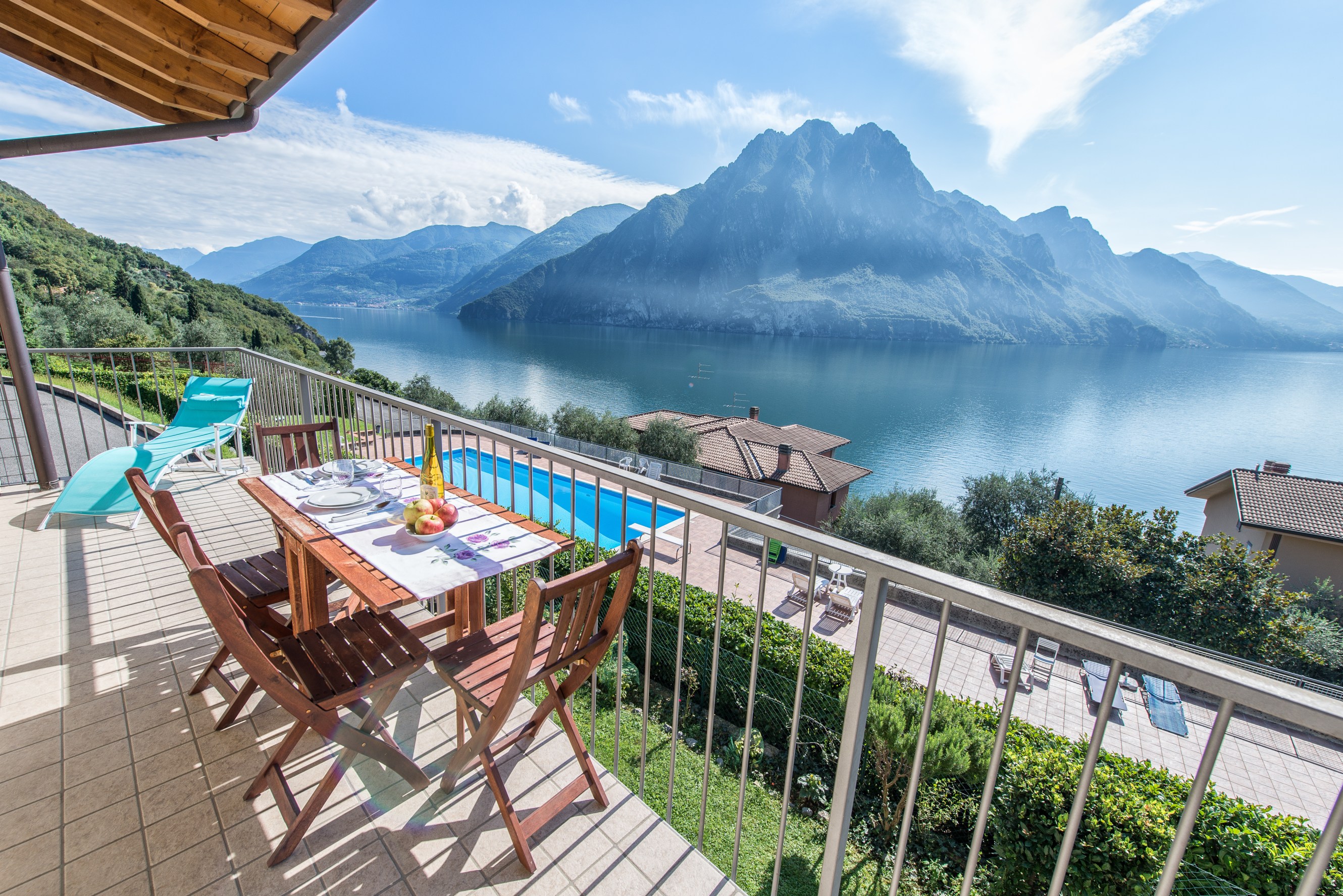 A balcony overlooking a lakeside mountain range in Riva, Italy