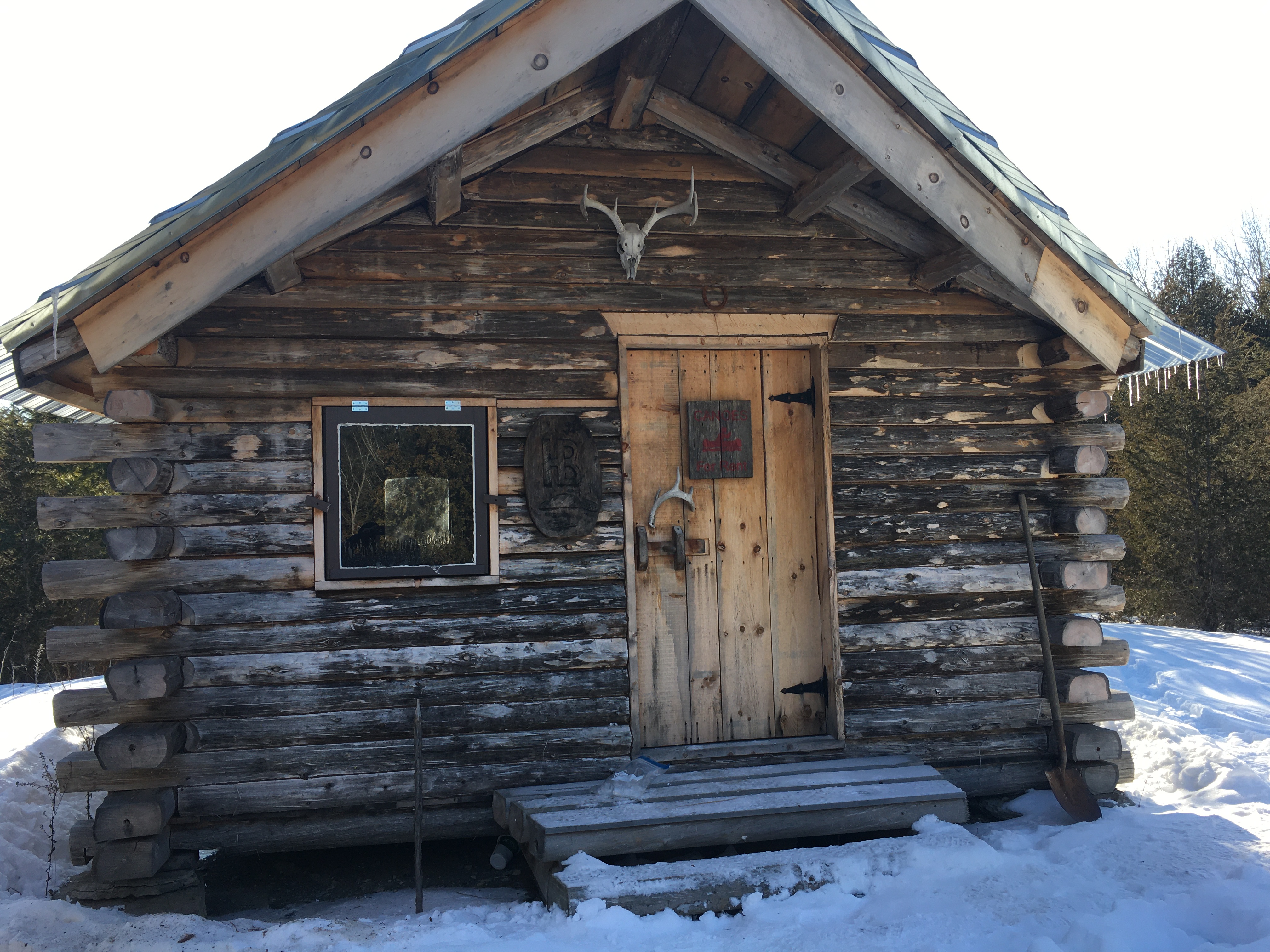 A rustic cabin in winter in Ontario.
