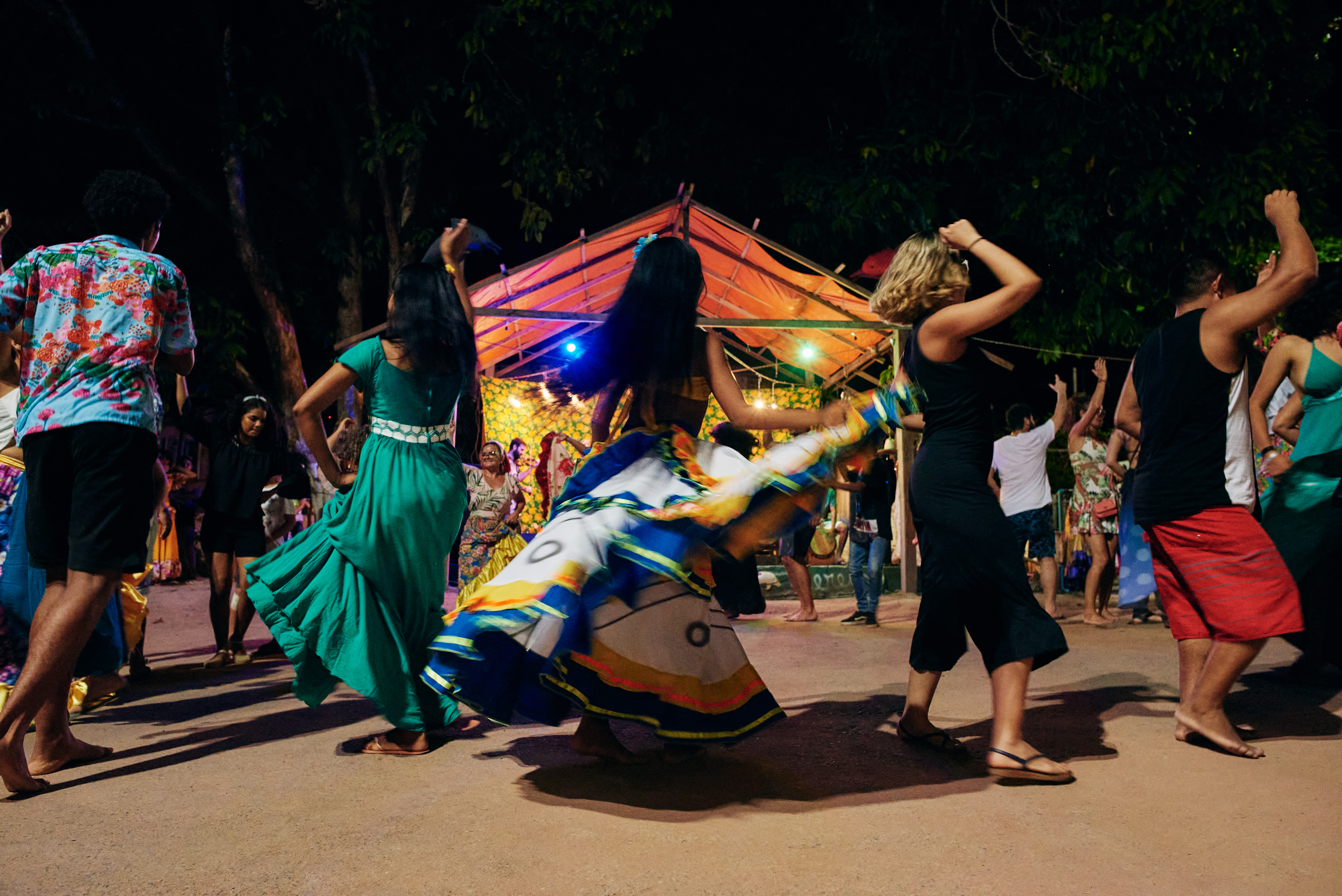 People with traditional colorful outfits dancing in the Carnival