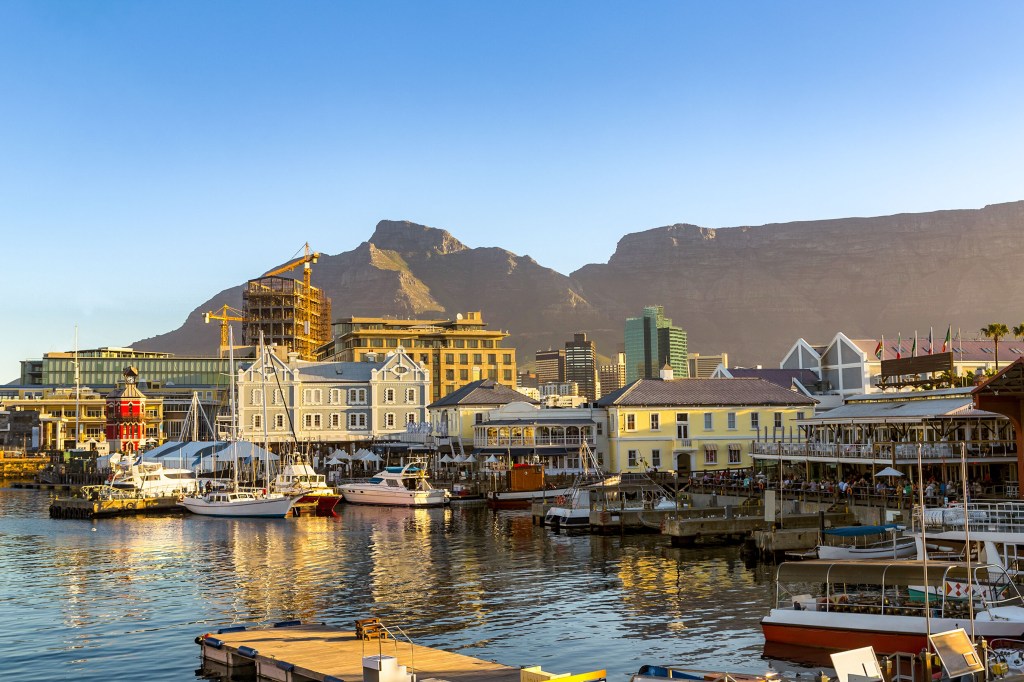Republic of South Africa. Cape Town (Kaapstad). Waterfront - Victoria Basin with historical buildings. Devil's Peak and Table Mountain in the background.