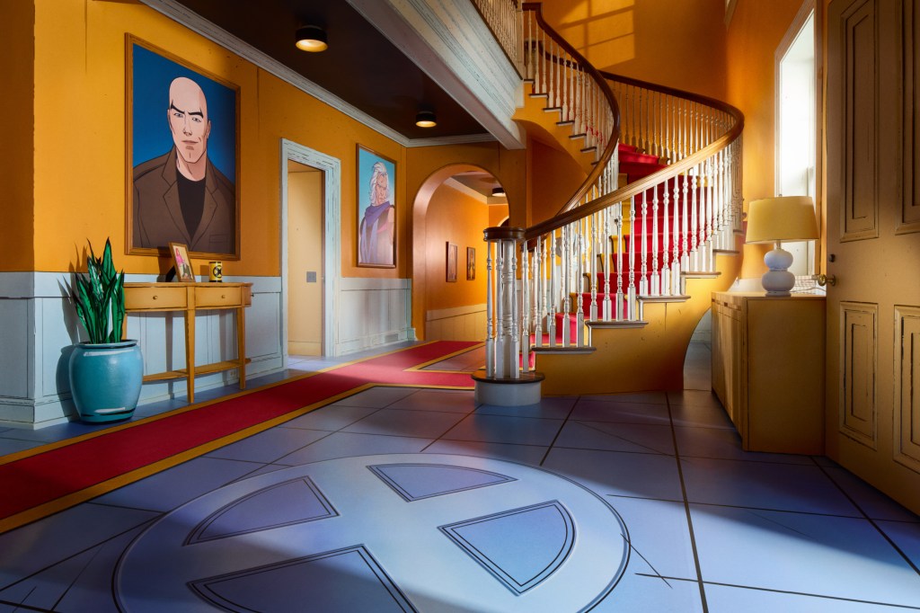 X-Men hallway, with images on the left wall leading down a hallway and a curved staircase to the right. 