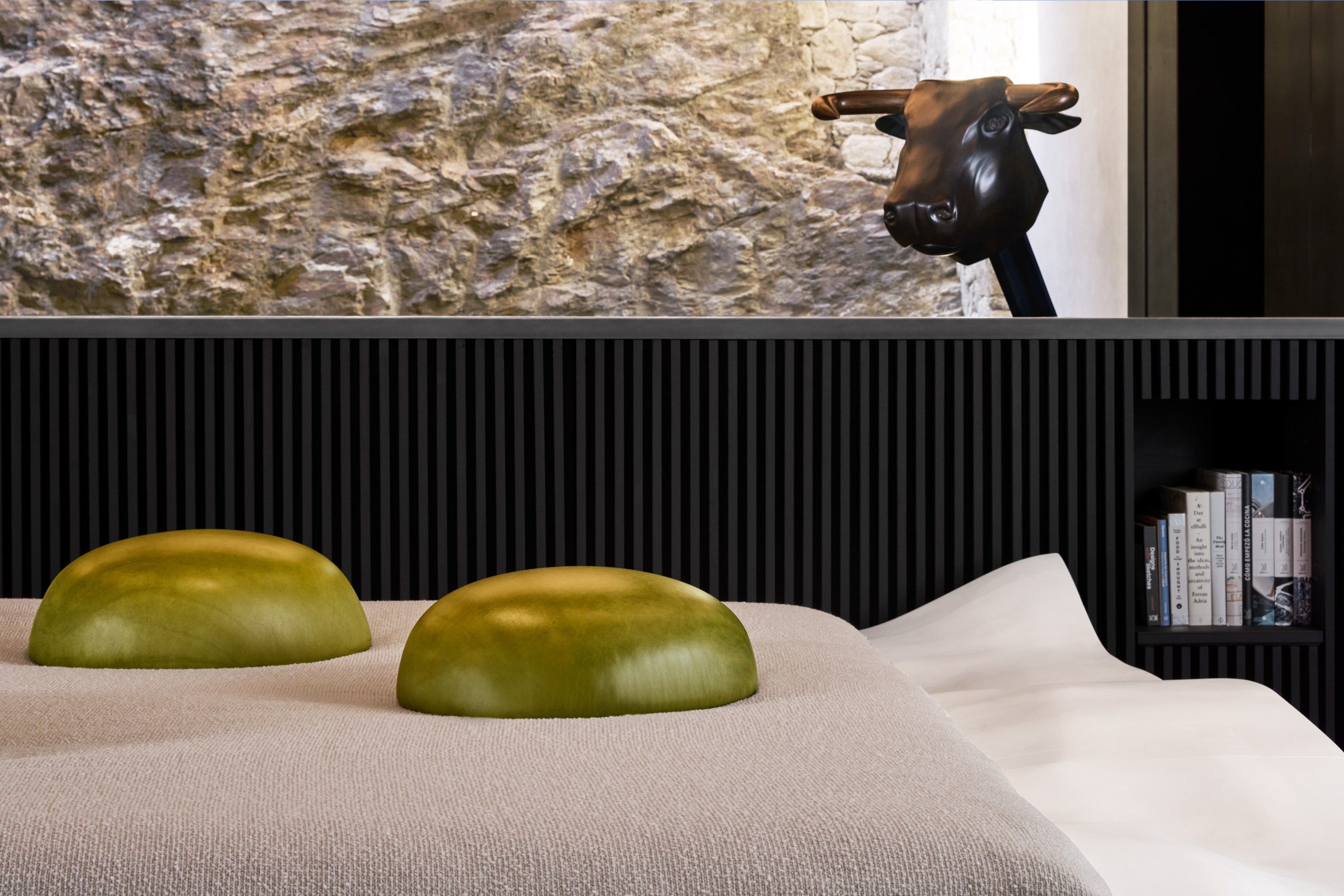 Close up of the bed - a specially designed piece of furniture inspired by one of the olive dishes by elBulli.