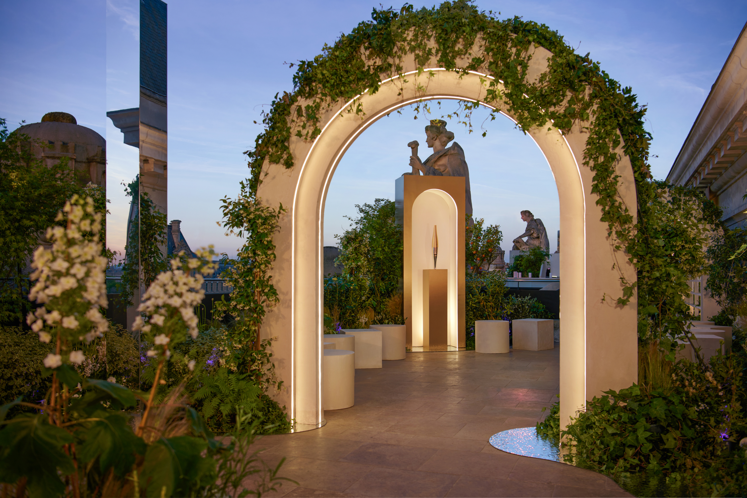 View of one of the specially installed arches on the terrace, decorated with climbing plants.