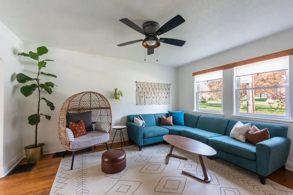 Living room with teal couch