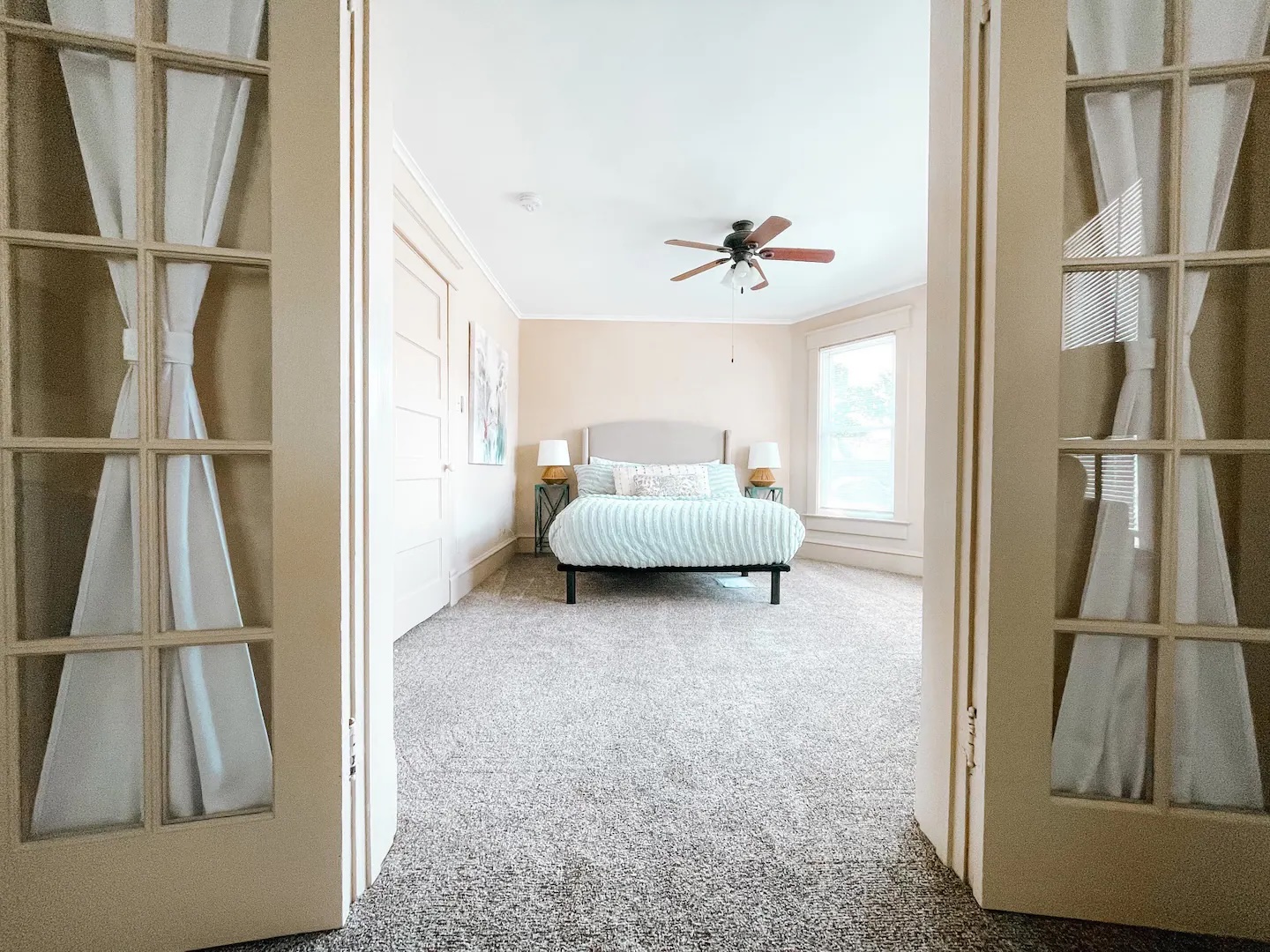 Bedroom with light green bed