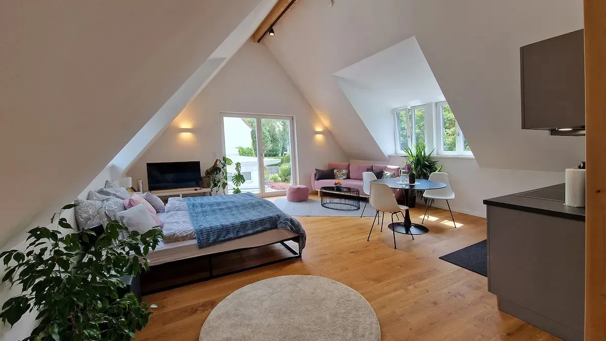 Bedroom with pointed ceiling
