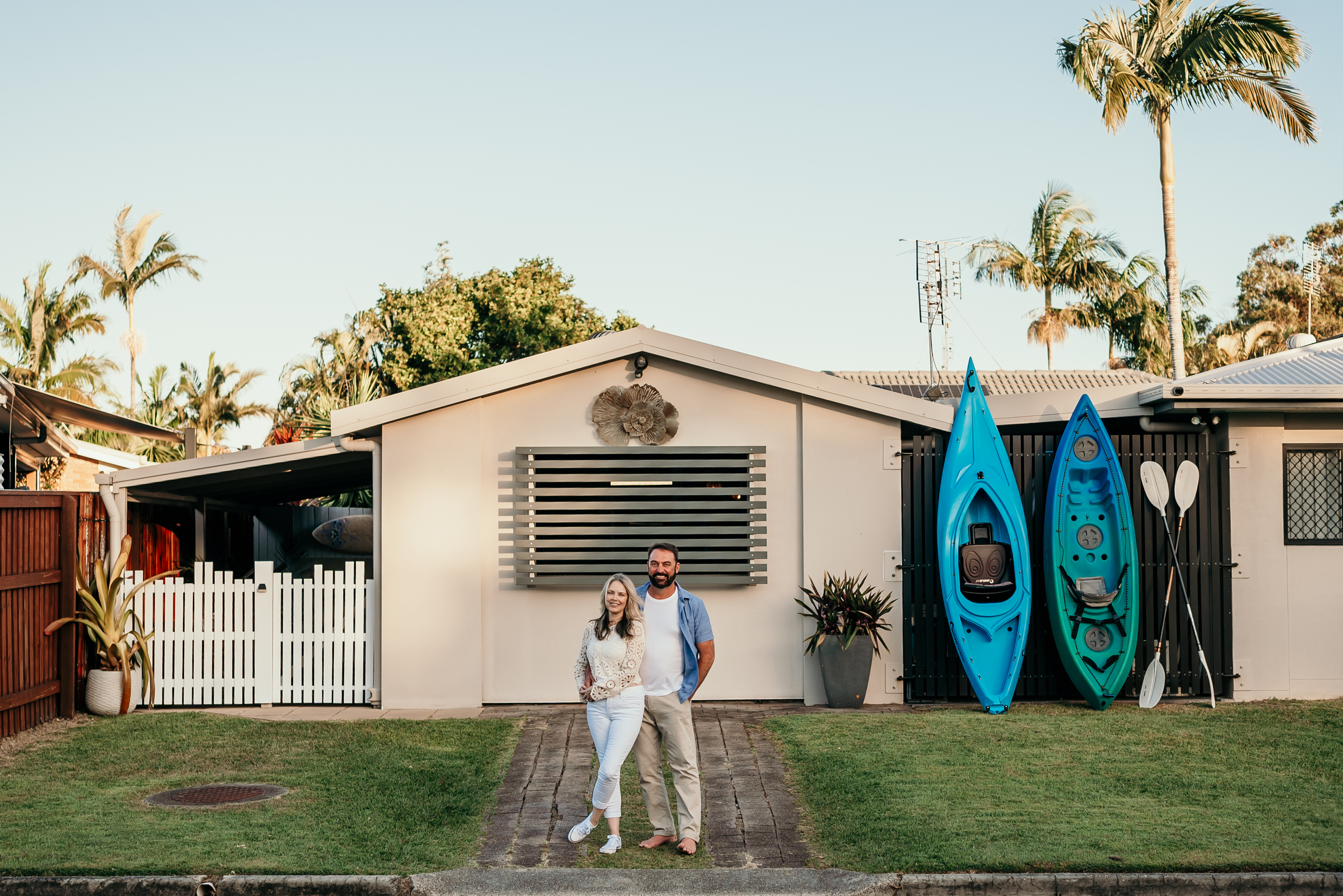 Image of host of the year 2024 winners for Australia standing out the front of their Airbnb