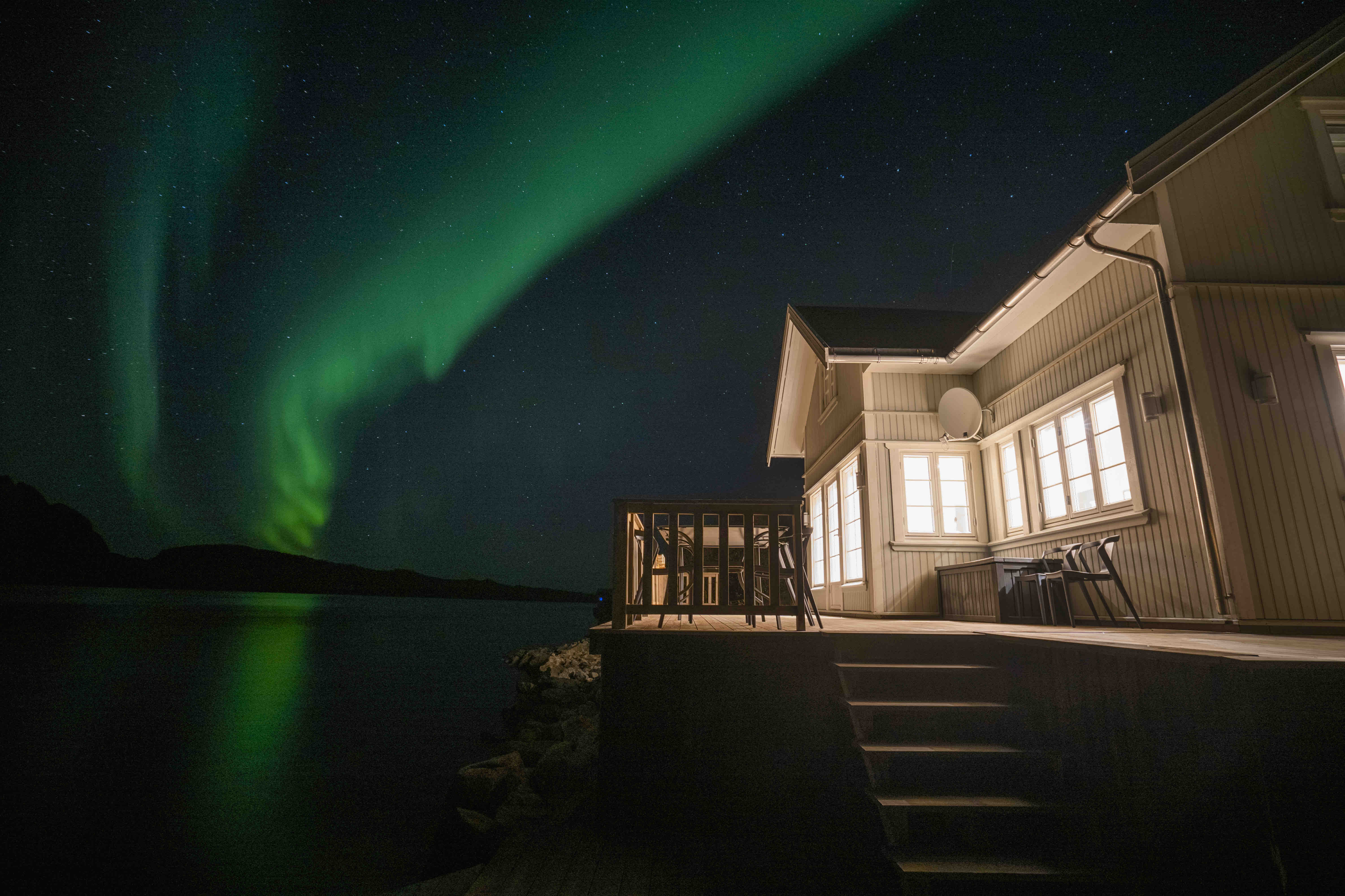 Cabin on the sea with Northern Lights view