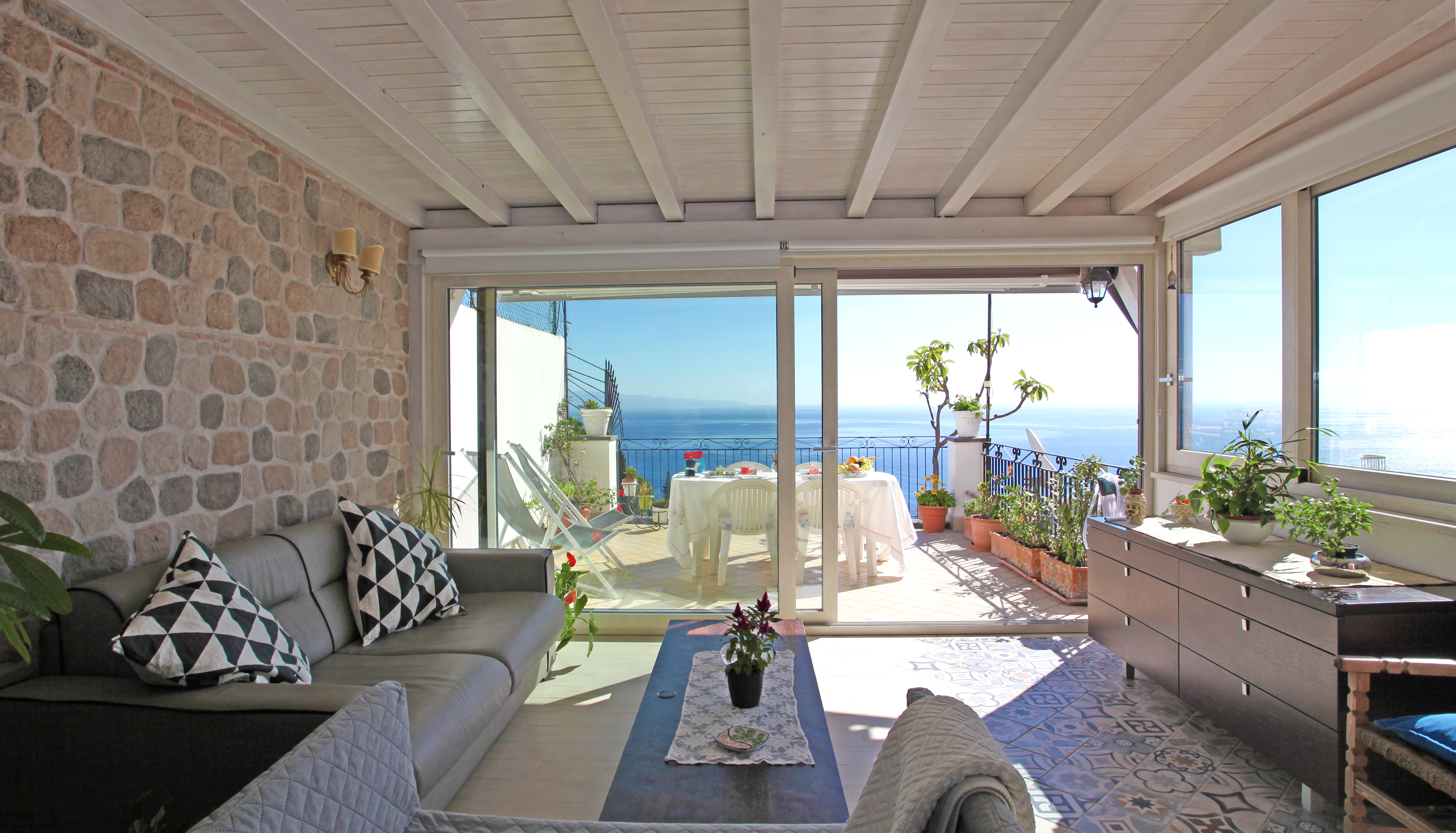 Interior of a house with sliding glass doors facing the ocean